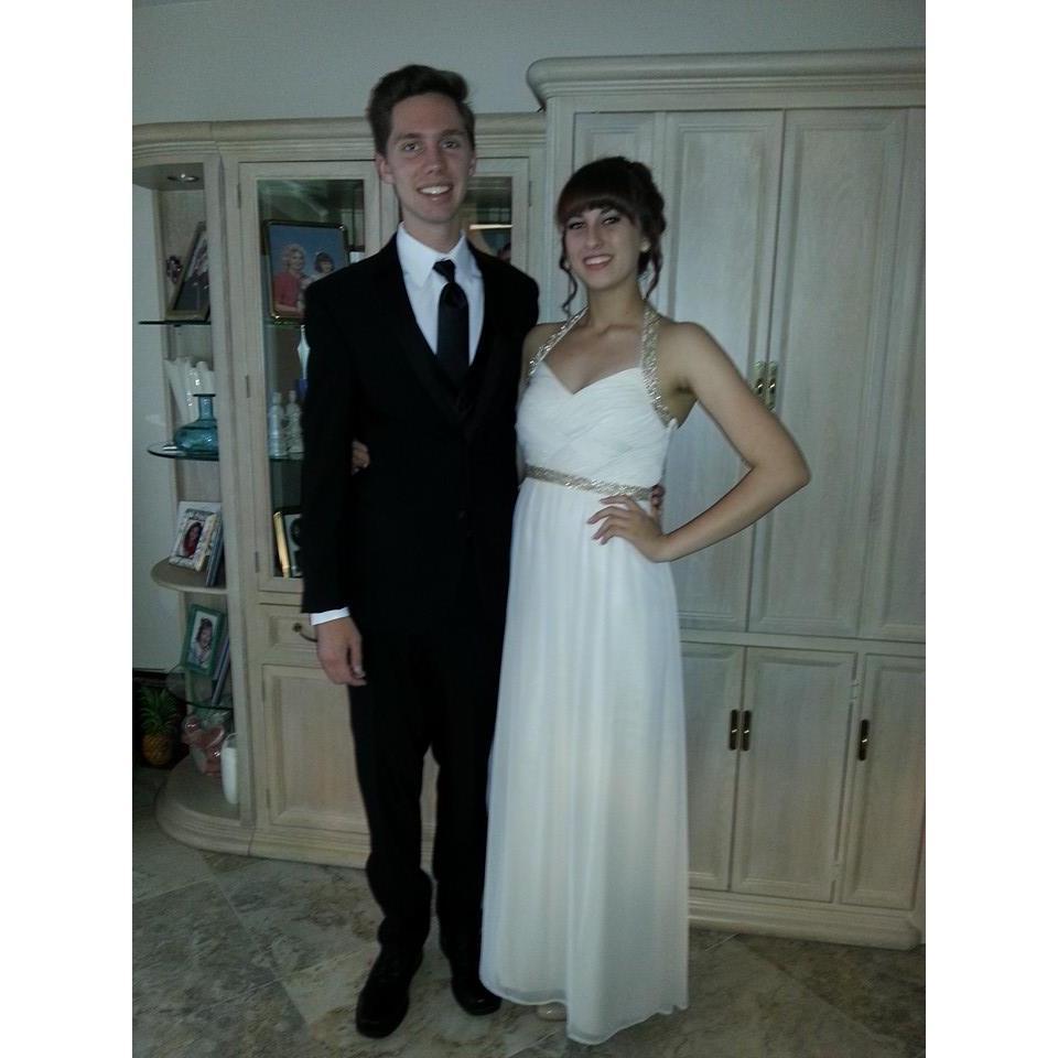 Our first prom together! We laugh now because it is total foreshadowing of us getting married with the color I am wearing!