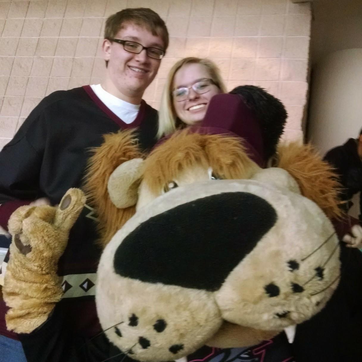 This picture is actually from Katie and Cody's first official date. Katie's mom drove them and actually convinced the Hockey Team Mascot to visit their seats.