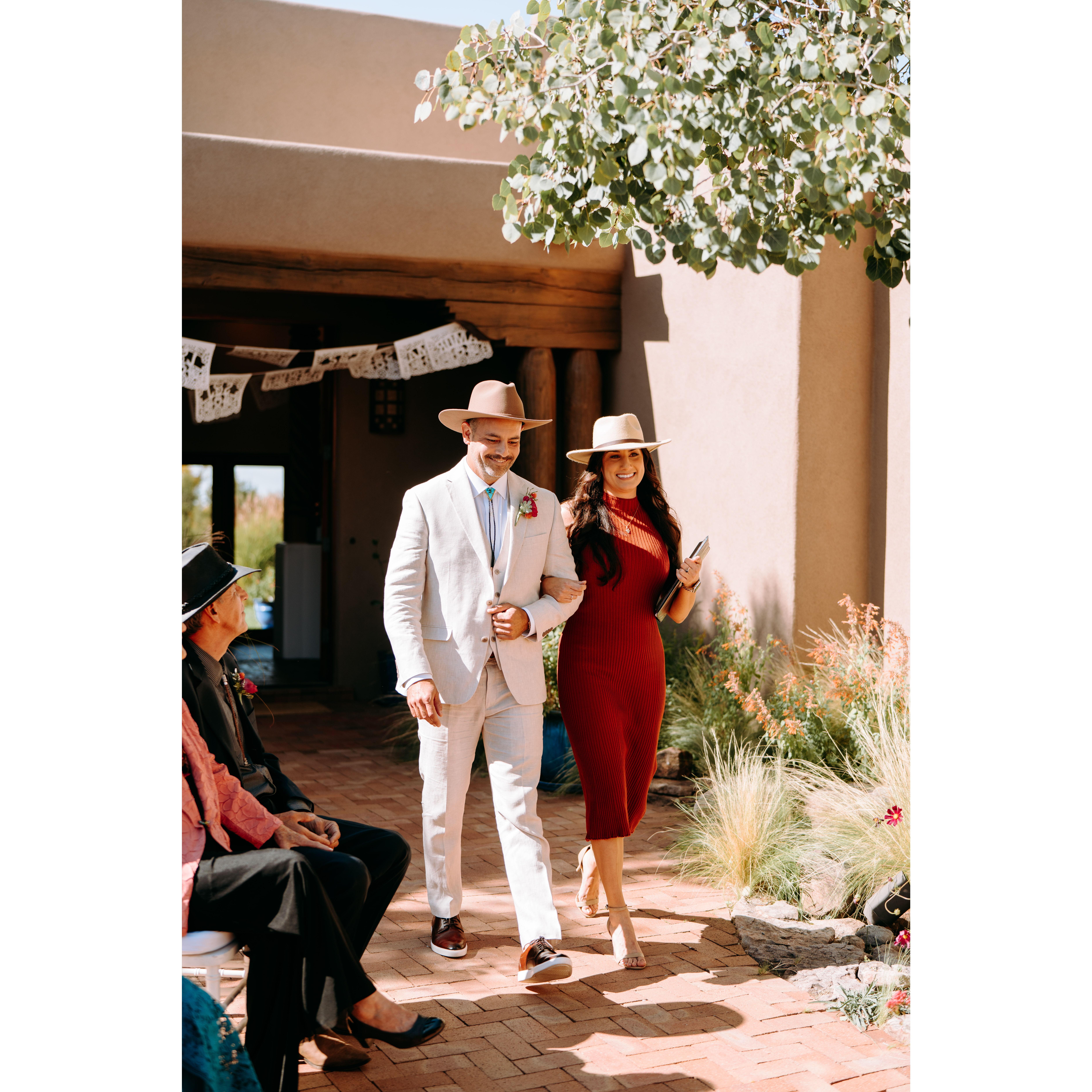 Shae and Marie (Shae's sister, aka Reverend Marie the officiant) walking down the aisle