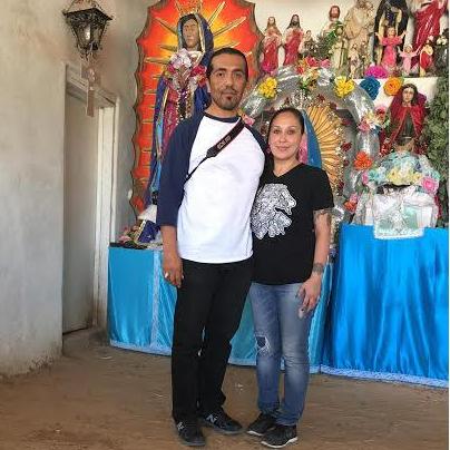 Lupe and Raul in Guadalupe, Arizona at the humble chapel for la virgen!