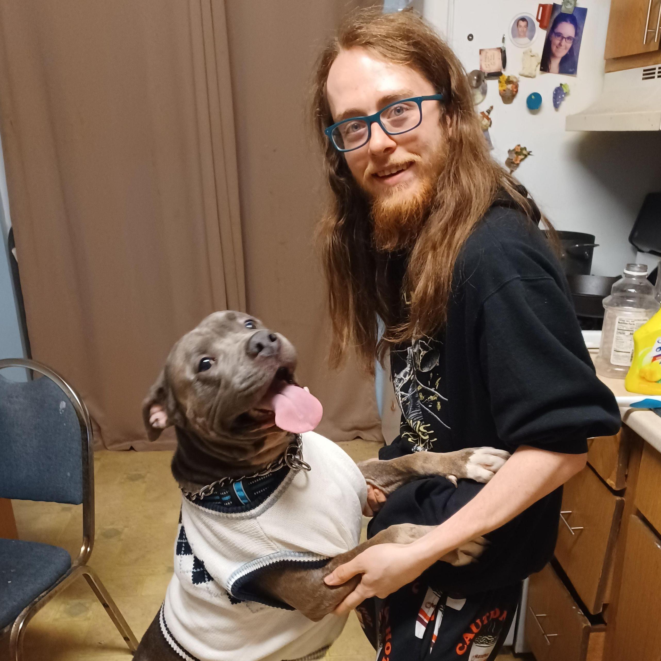 Jay dancing with our friends' dog, Ace, in our kitchen