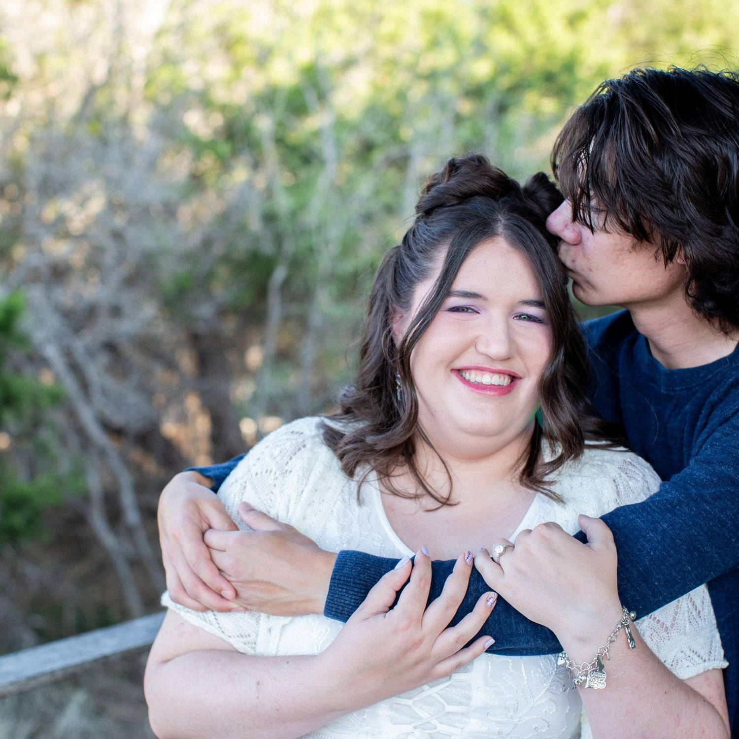 Initially my arm was over her boob and the photographer had us do it again