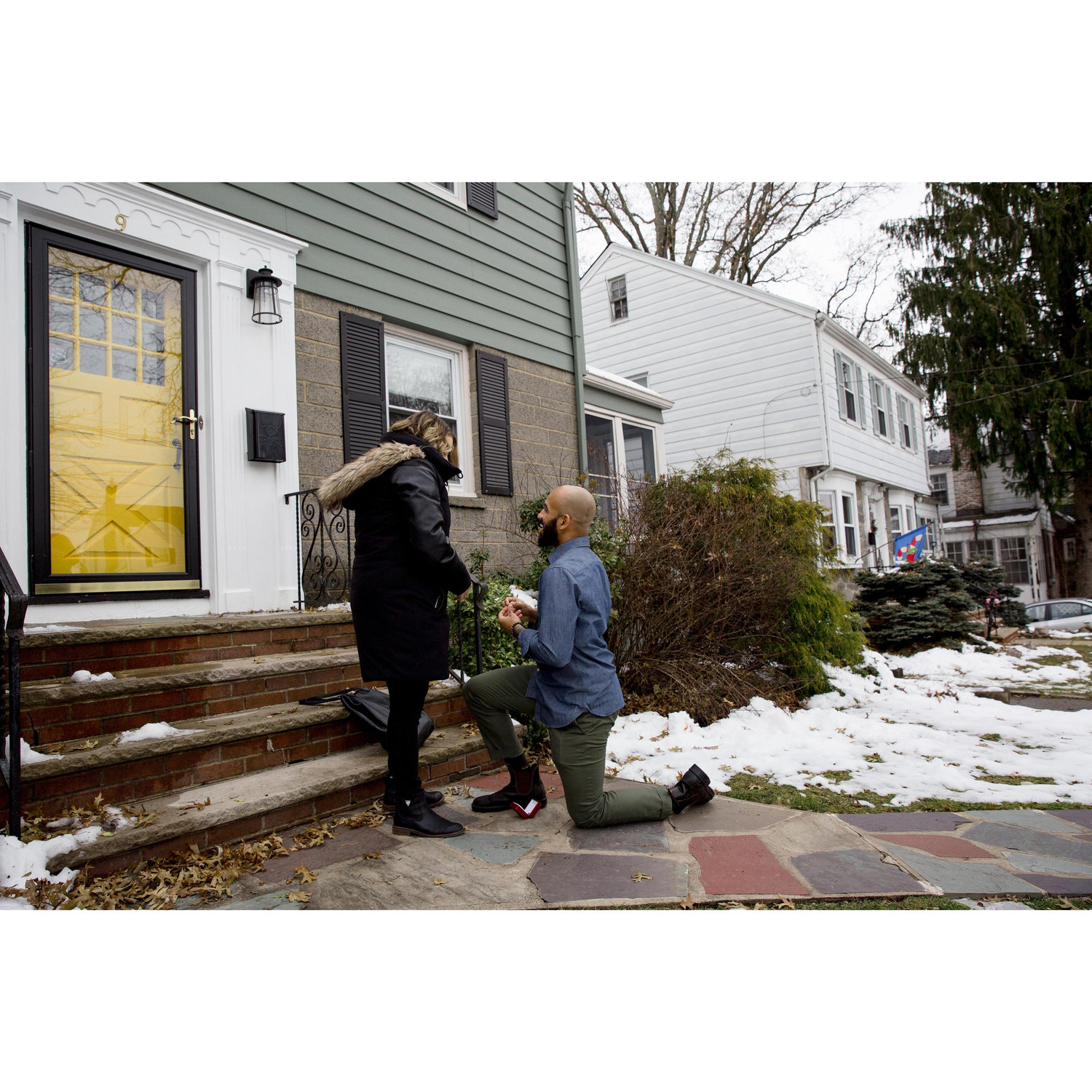 Norm popping the question in front of the couple's new home in New Jersey (right after the closing).
