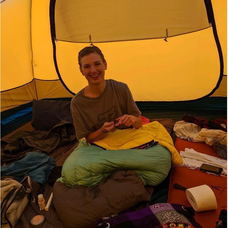 Her enjoying the sleeping bag he sold her the first time they met.