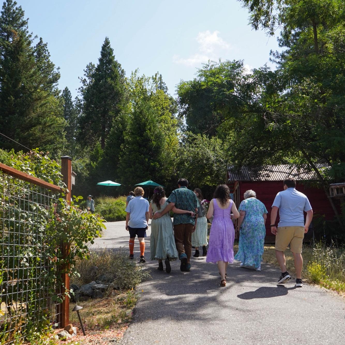Walking up the driveway to the wedding spot.