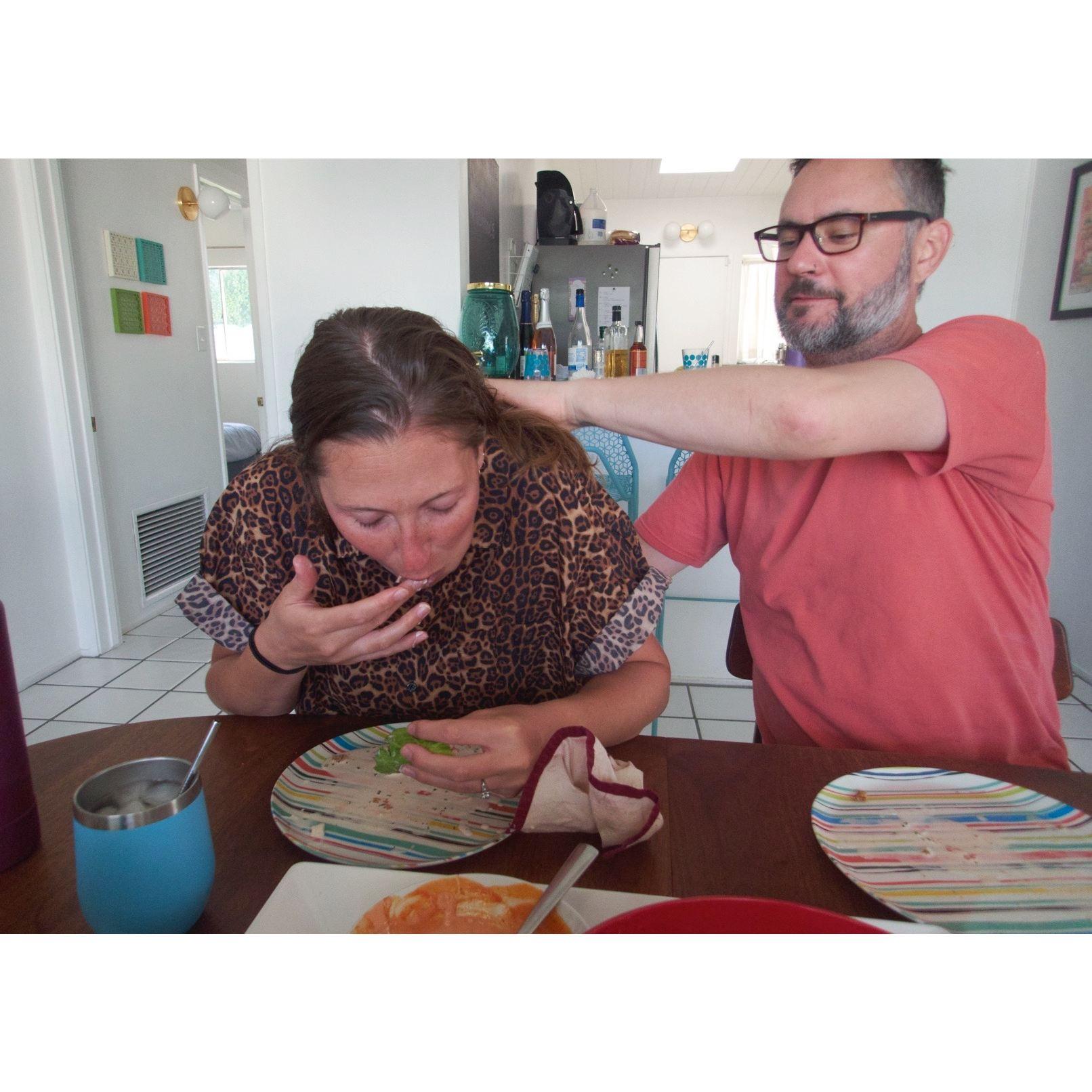 He always holds her back when she needs to stuff into her mouth.