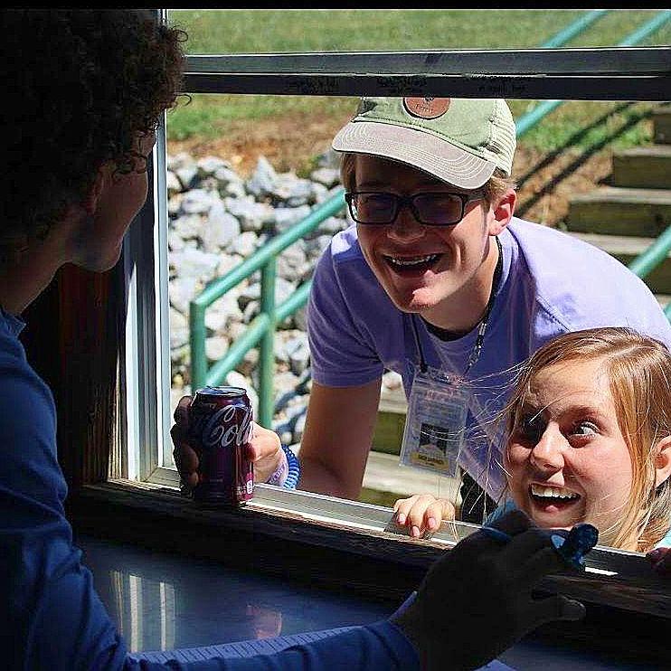 Julia snuck up on Jonathan at camp when he was working in the snack bar!