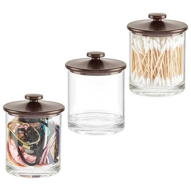 mDesign Modern Round Plastic Bathroom Vanity Countertop Storage Organizer Canister Apothecary Jar for Cotton Swabs, Rounds, Balls, Makeup Sponges, Bath Salts, 3 Pack - Clear/Bronze