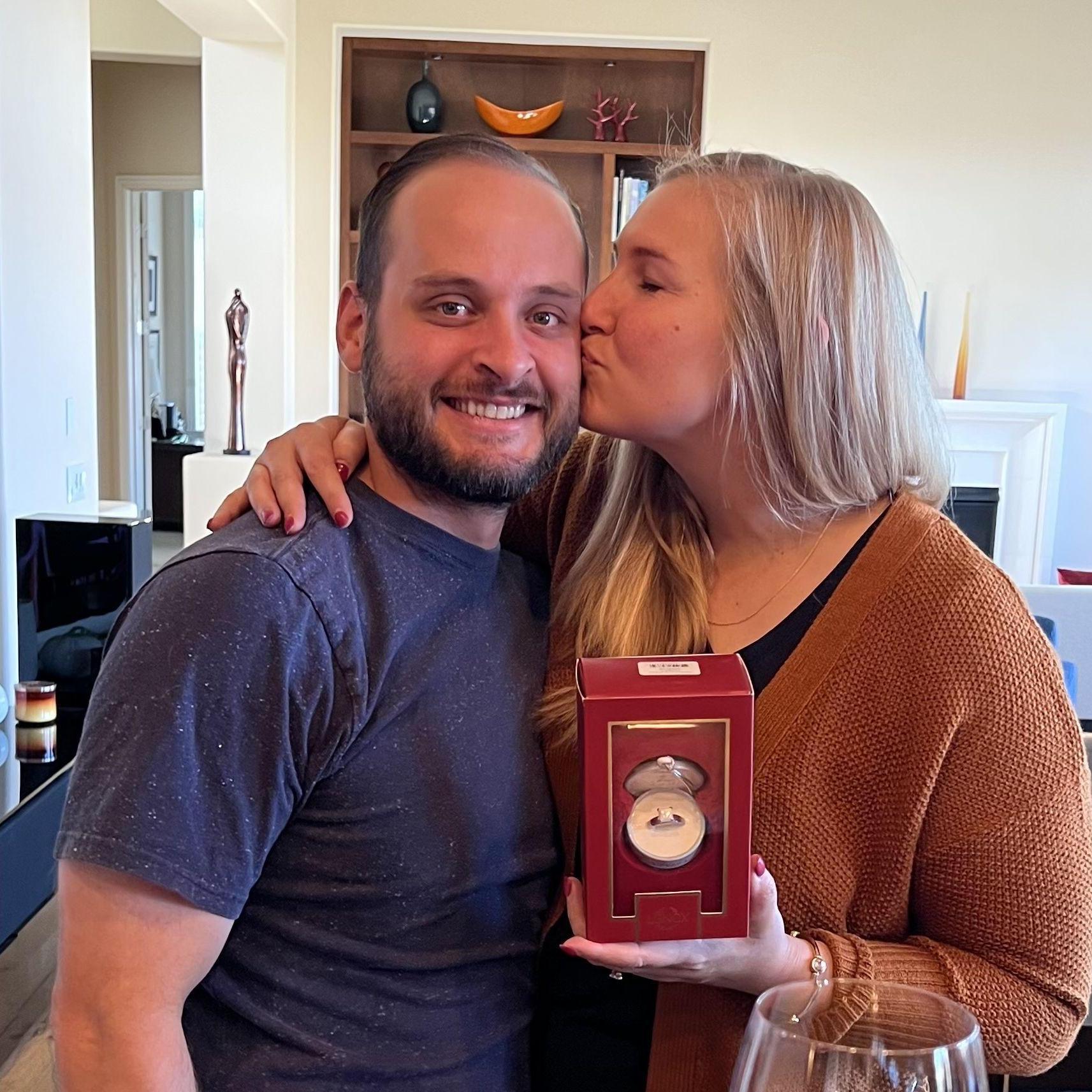 This is our 2023 Christmas ornament from Michael's parents. 
An engagement ring!
