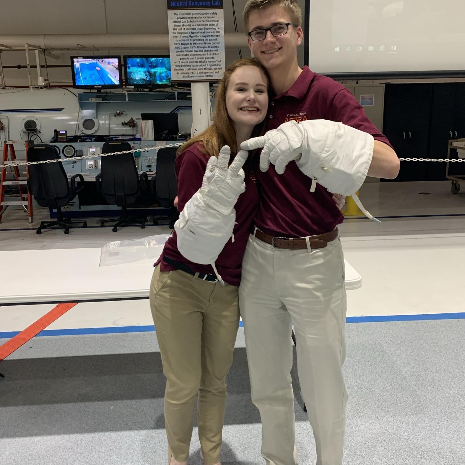 At the Neutral Buoyancy Lab in Houston TX wearing real astronaut gloves.