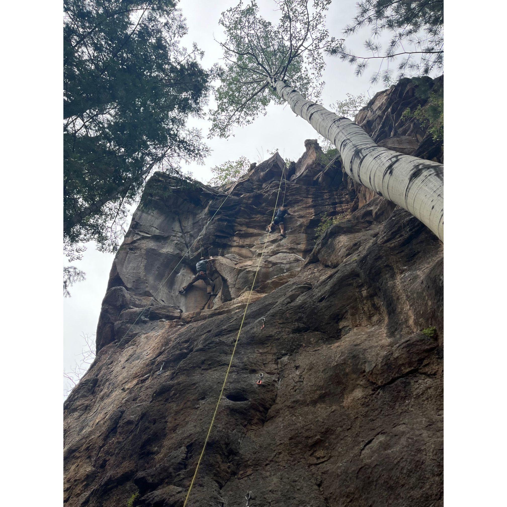 After being friends for a year, Caleb asked me on a date. This date was followed by a 3-day camping trip with friends! You can see Caleb and I climbing in this photo.