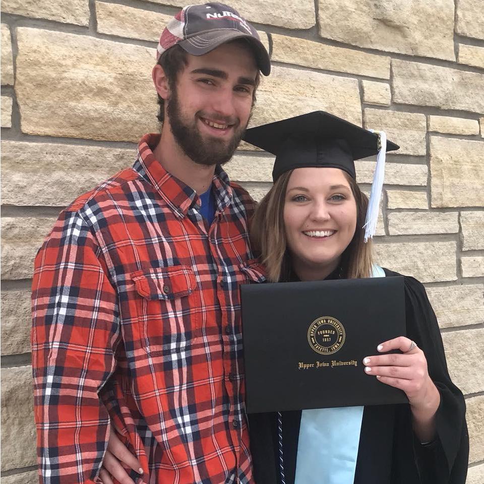 Devin helping Morgan Celebrate getting her Bachelor's Degrees.