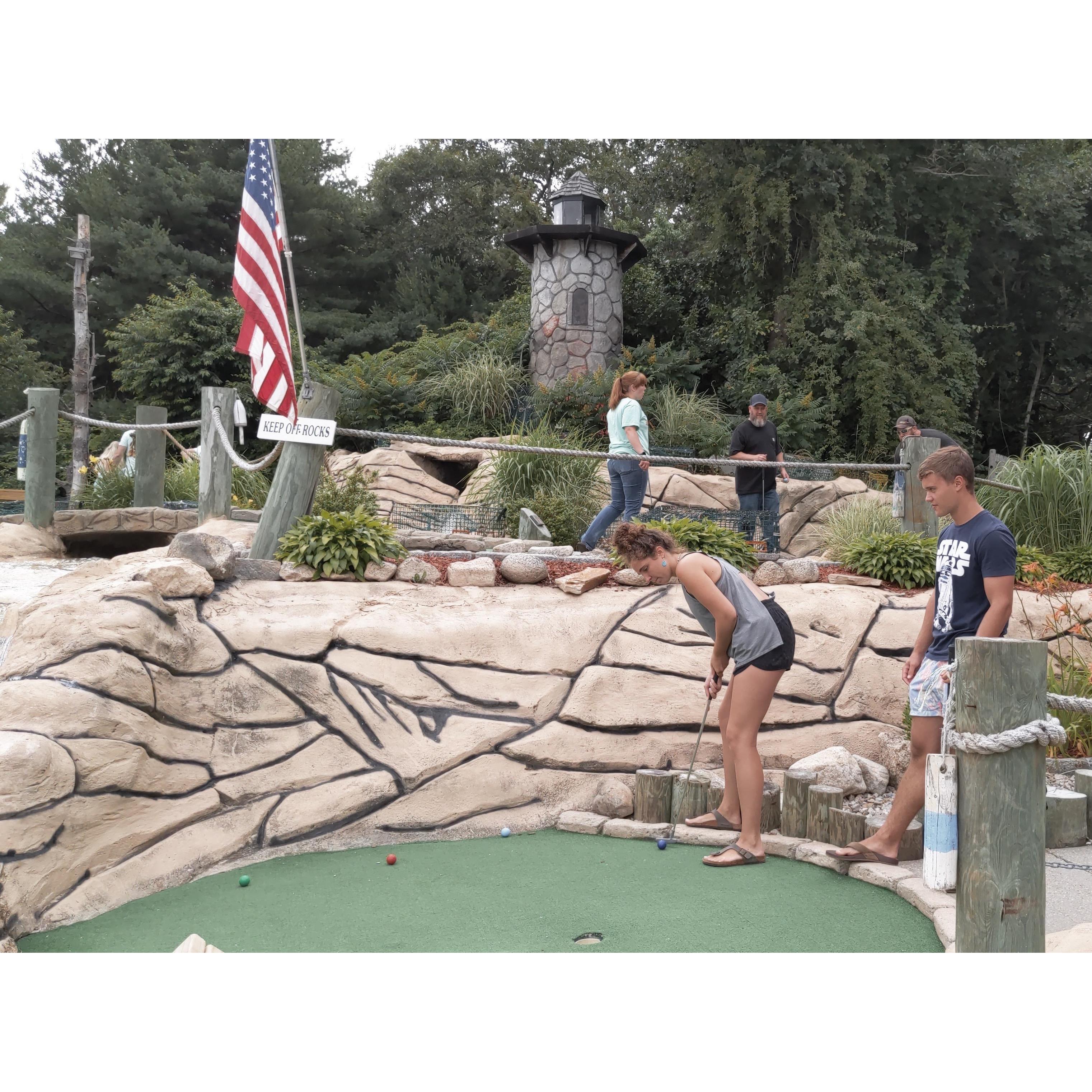 playing mini-golf together with Anna's family