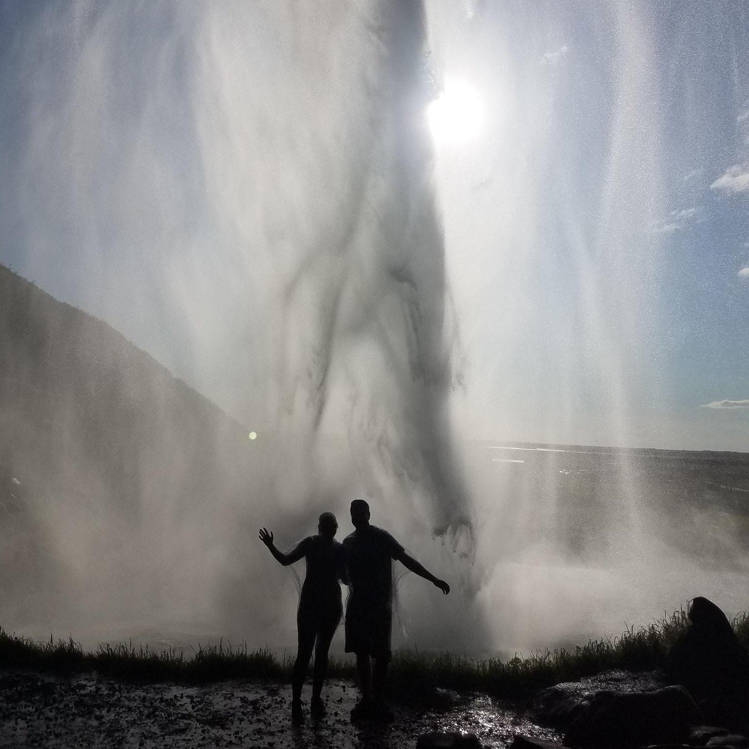 Behind a waterfall in Iceland, looking like idiots because Delta left our bag in Minneapolis which had our warm clothes and rain gear. Summer 2018