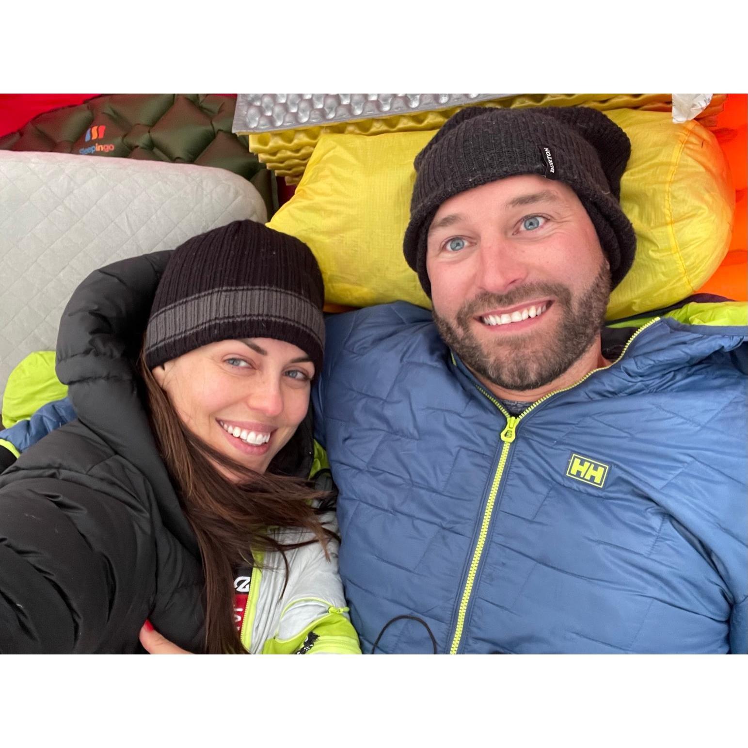 Getting warm in a snow-covered tent in The Enchantments