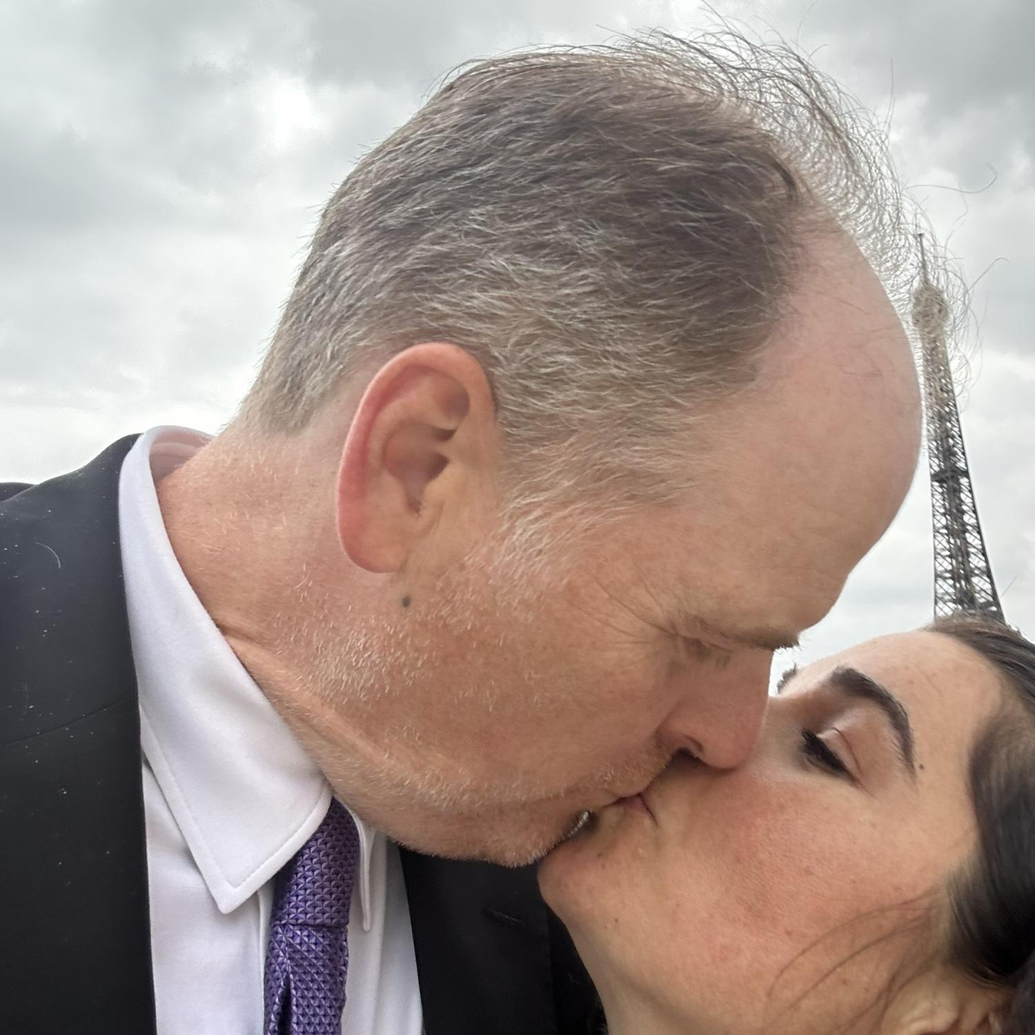 In front of the Eiffel Tower after eating at Jules Verne