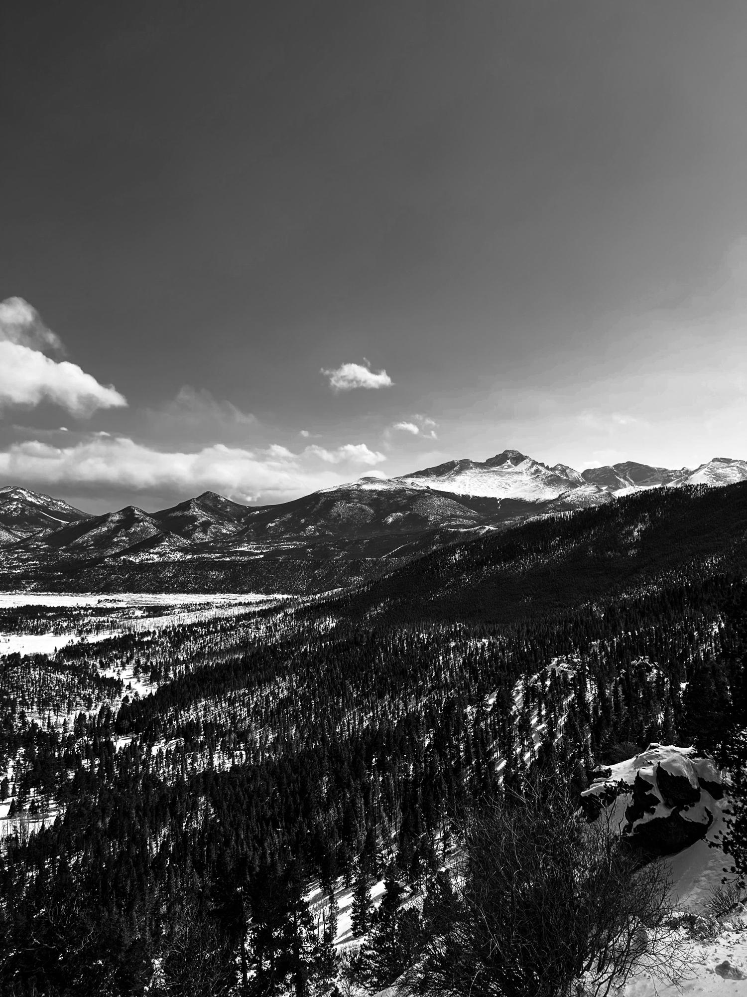 The spot where Ian got down on one knee. 

Many peaks lookout at Rocky Mountain National Park