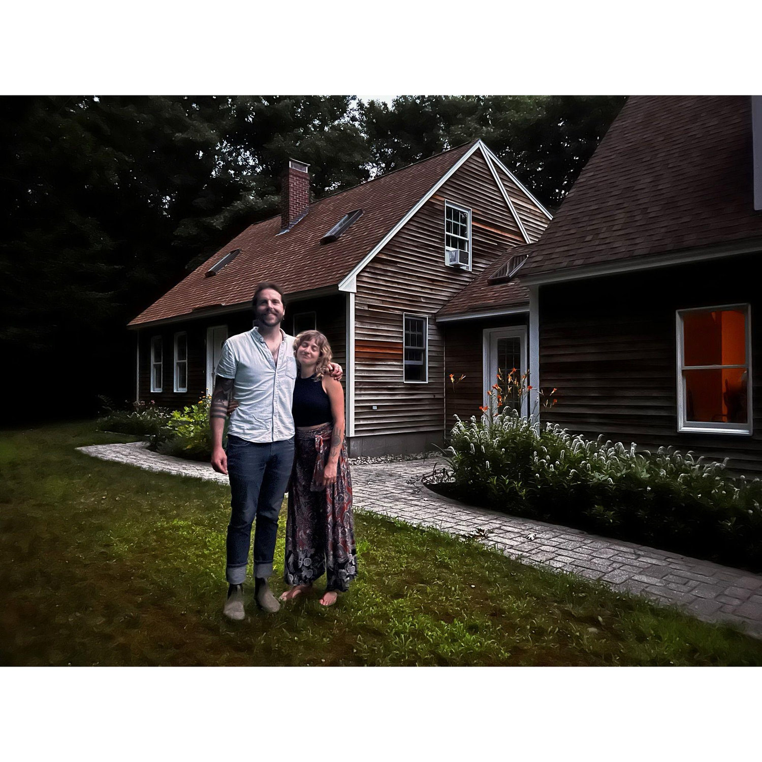 Our first photo together after buying our house! it's not really a good photo! but it's fun!