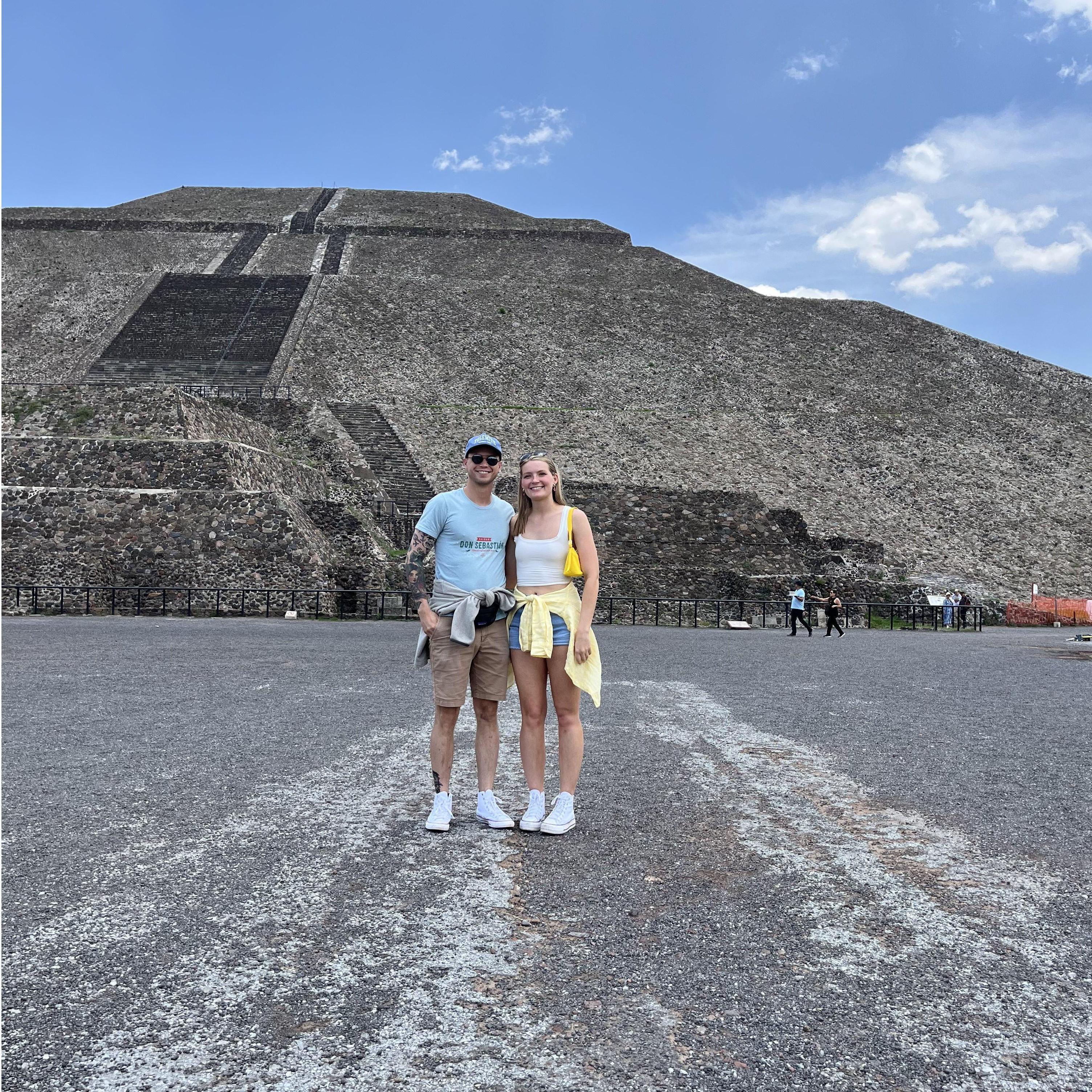 2023 - Our first trip out of the country together! We are standing in front of the Pyramid of the Sun in Teotihuacan, Mexico.