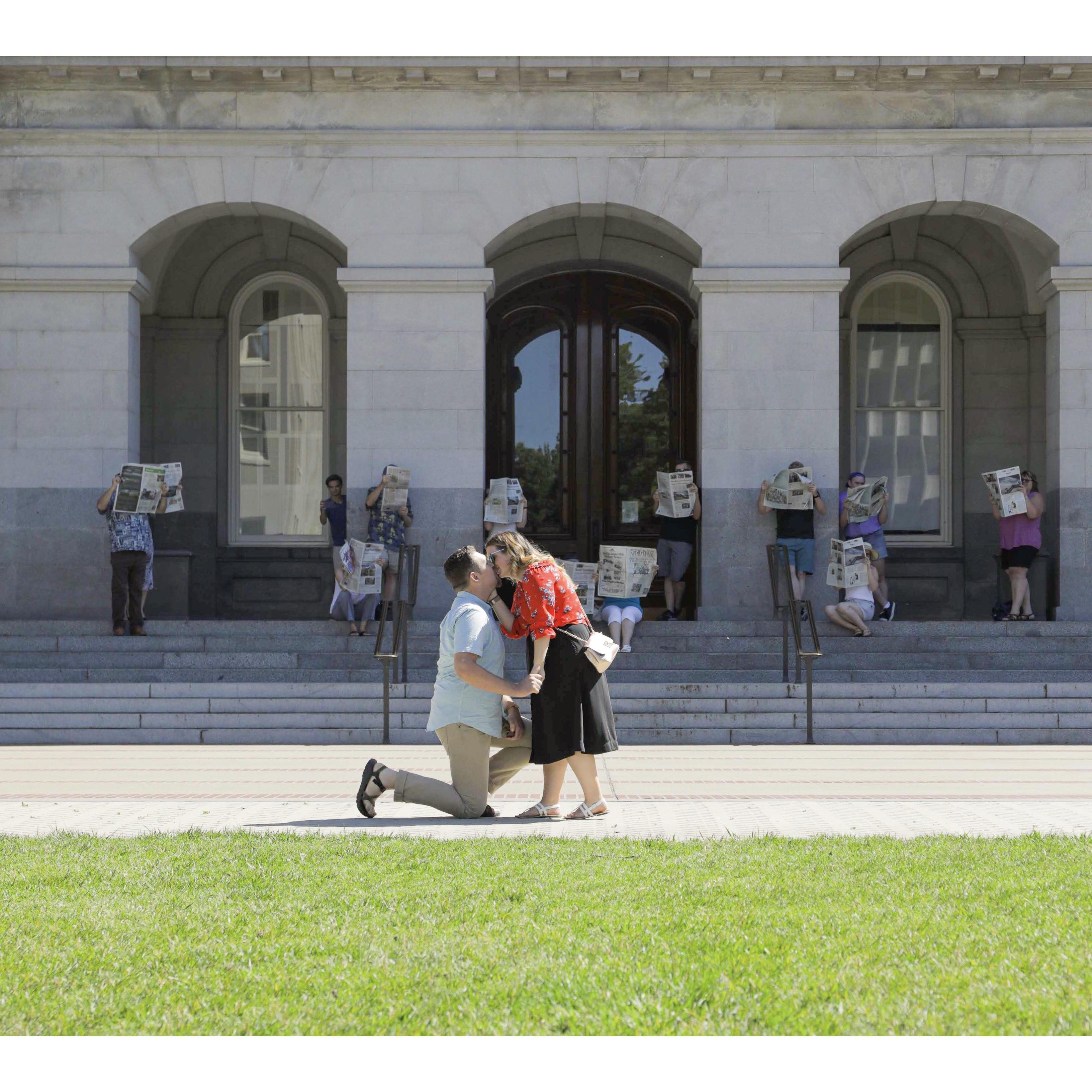 We walked over to a beautiful little spot on the lawn, people came out from behind the pillars, Kris asked me to be his wife, I said YES, and we shared our first kiss! ❤️