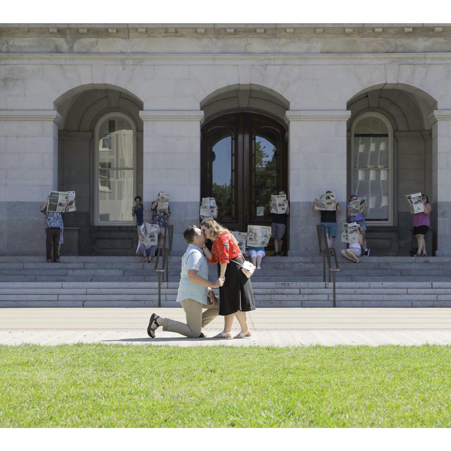We walked over to a beautiful little spot on the lawn, people came out from behind the pillars, Kris asked me to be his wife, I said YES, and we shared our first kiss! ❤️