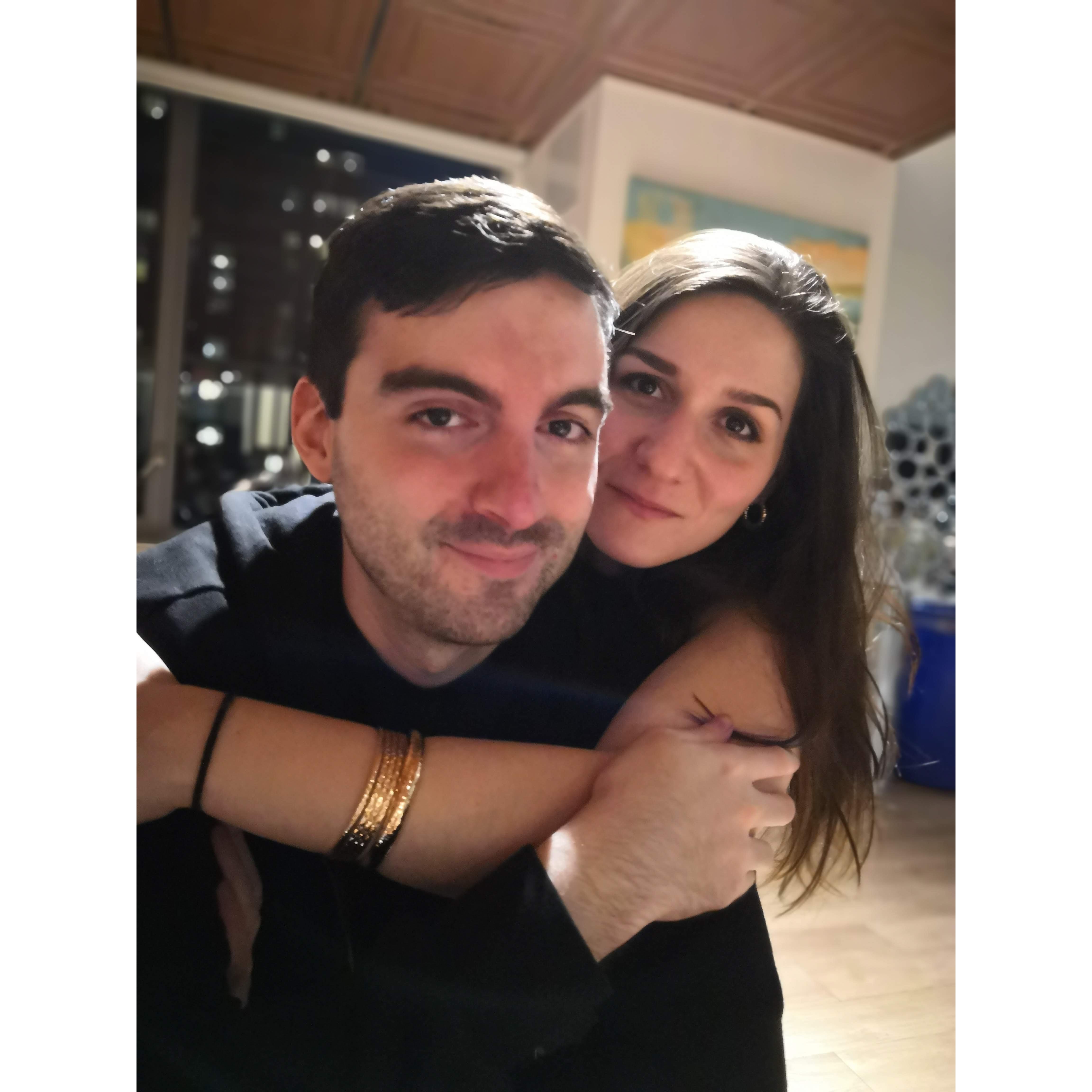 "Stella's favorite picture of us, taken at David's birthday party by her coworker Jon, who was showing off his iPhone's portrait mode along with his sunglasses that doubled as a cheese knife."