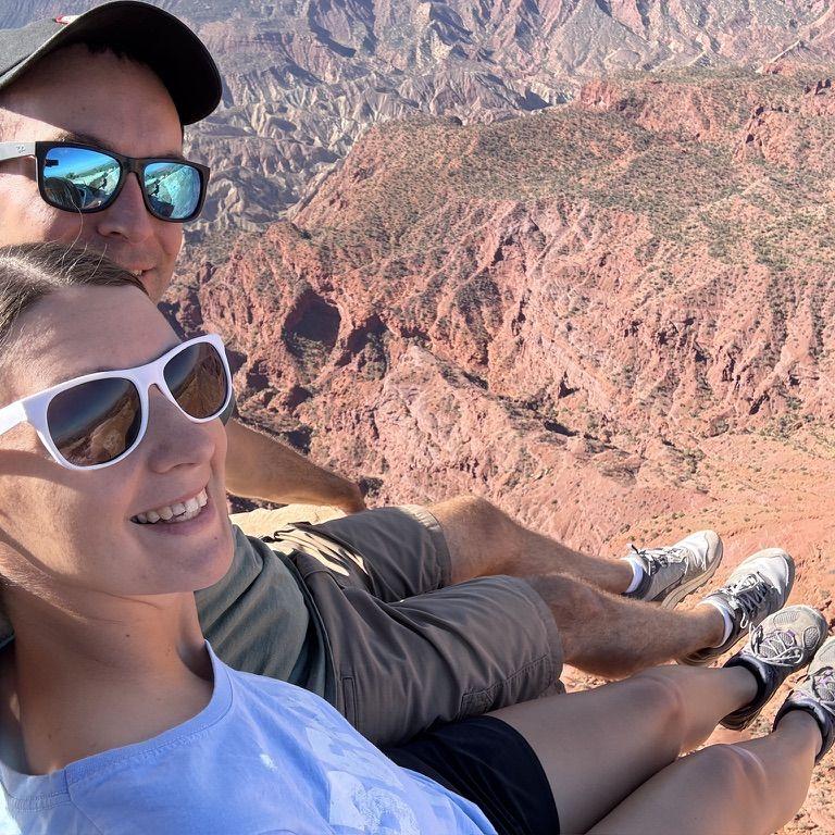 Feet dangling at the Top of the World - Moab, UT