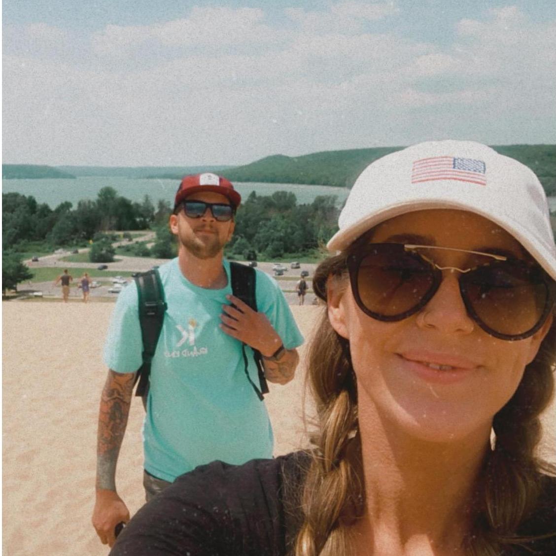 We love getting outside and hiking. This photo was taken at the Sleeping Bear Dunes in Northern Michigan