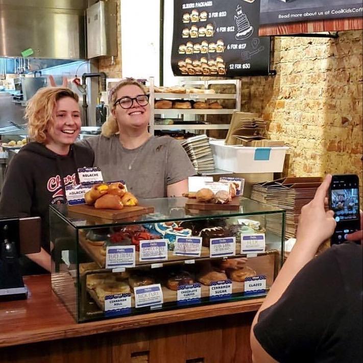 This is probably one of the oldest pictures of us-- we met working at District Donuts in New Orleans. Maddy was a barista, and Katie worked in the bakery.