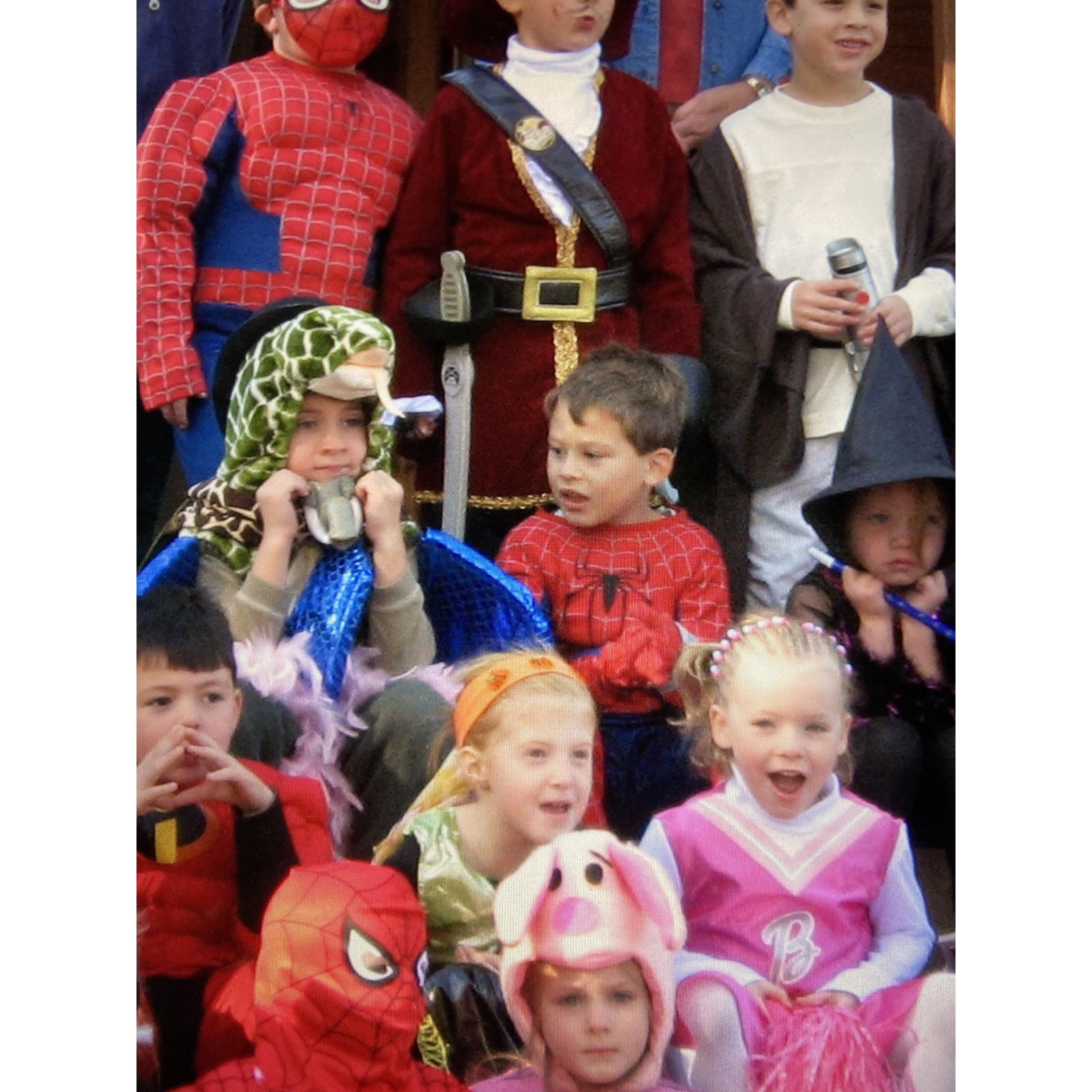about a year into us dating we figured out we were in the same preschool class, see if you can find us in our halloween costumes!