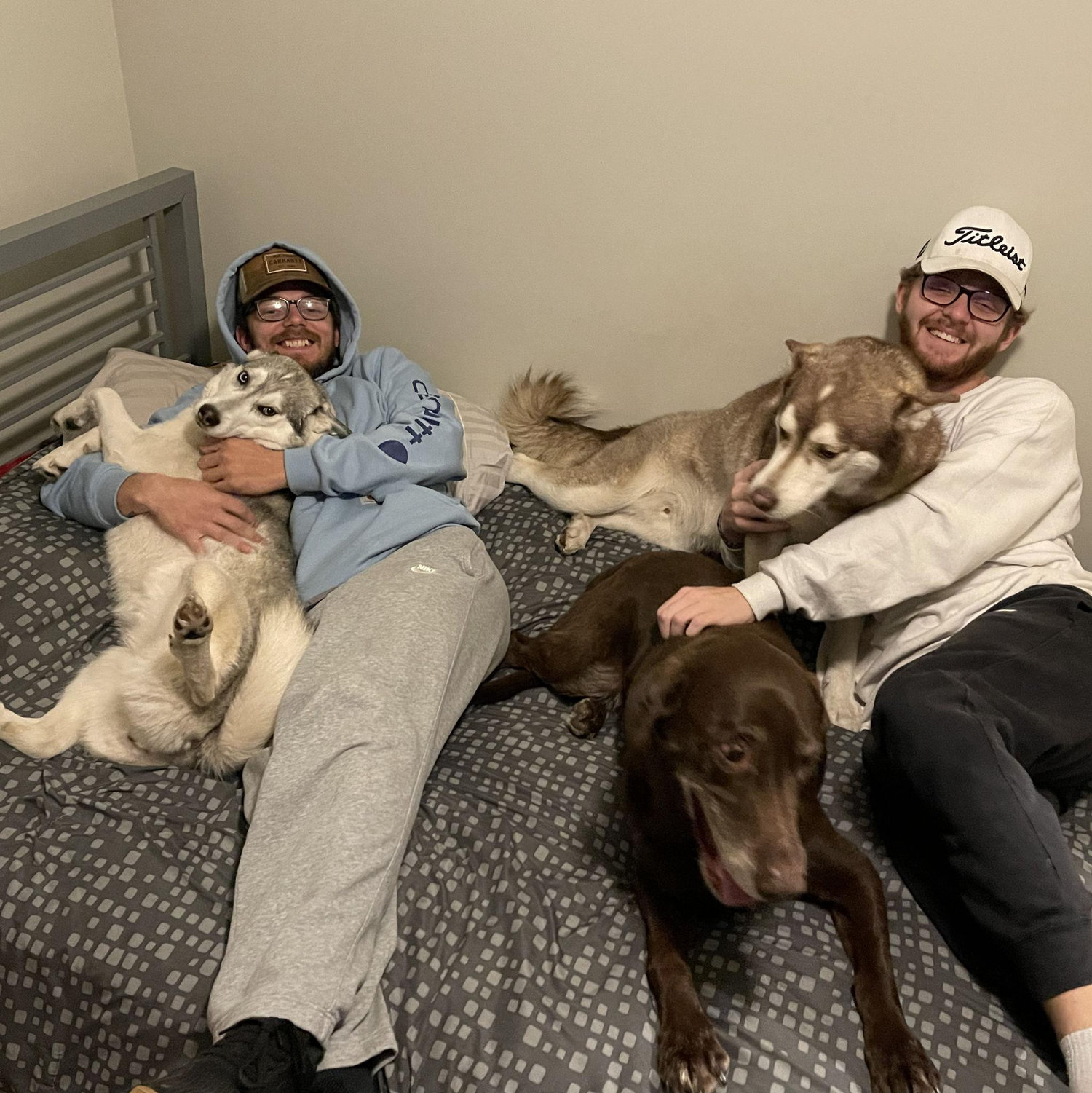 Kaleb and Tristan with their dogs Layla, Loki, and Bullet - 2022