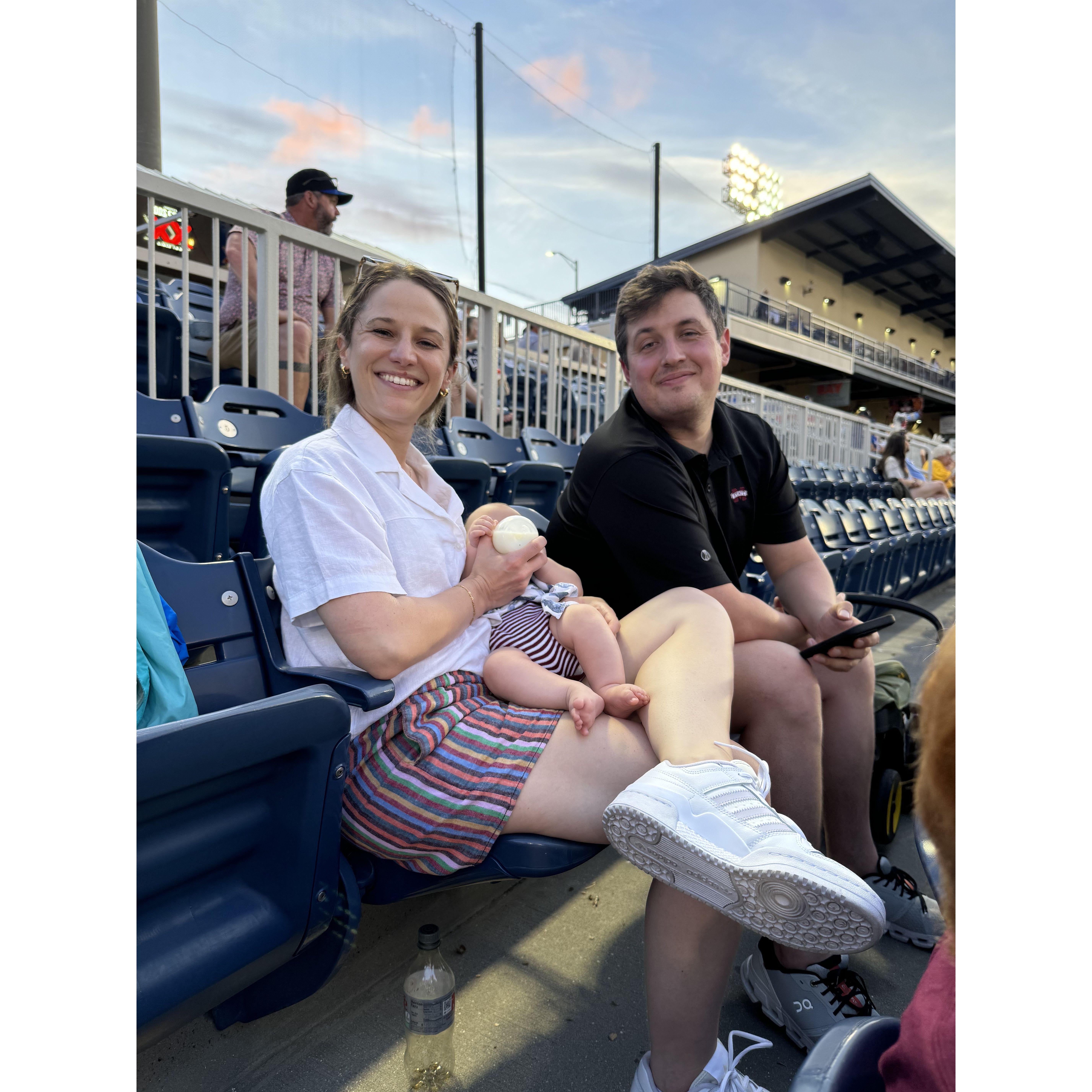 home in biloxi with baby jayce at a shuckers game <3