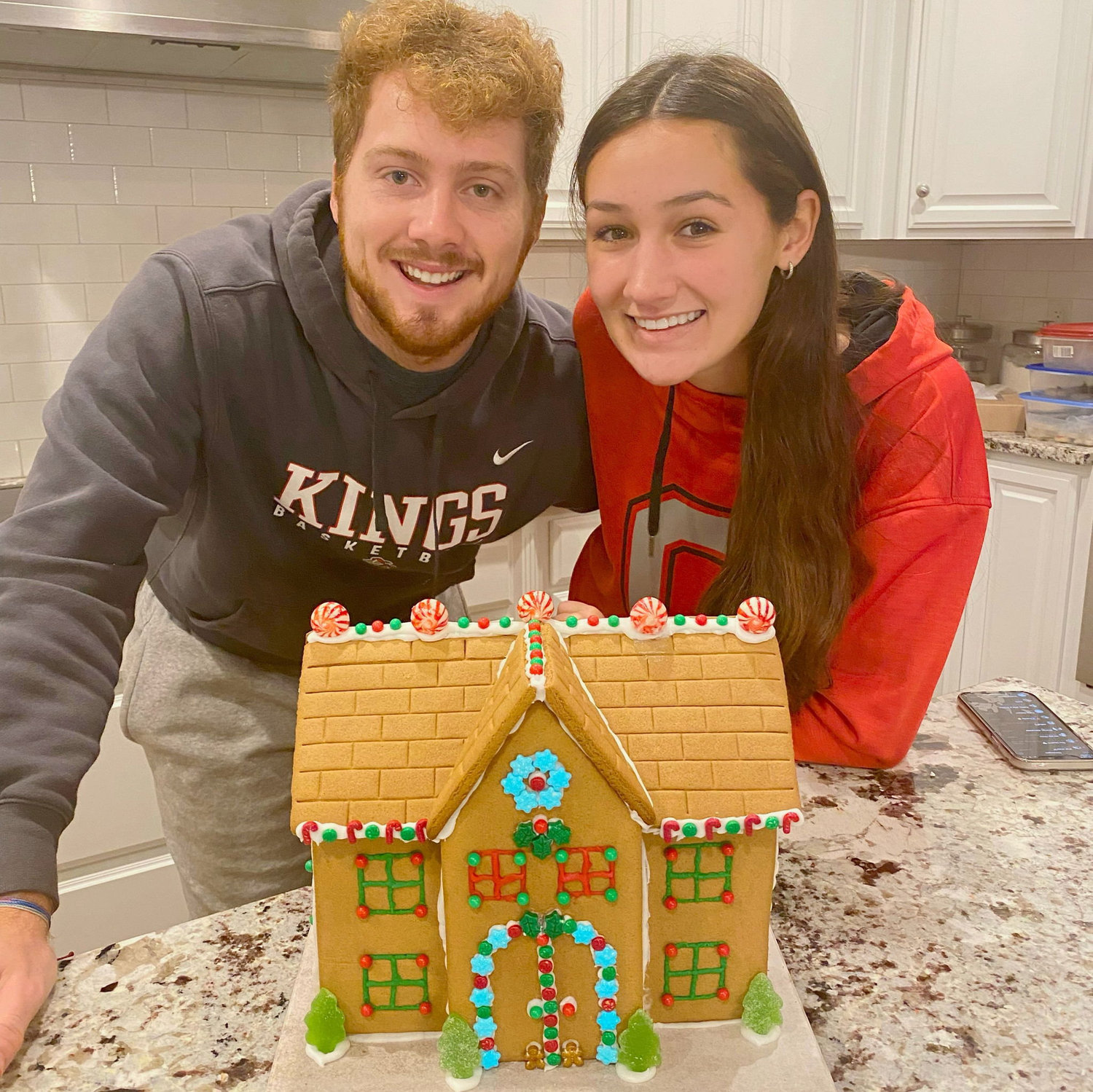 Our first time building a gingerbread house together. We quickly discovered our new hidden talent!
