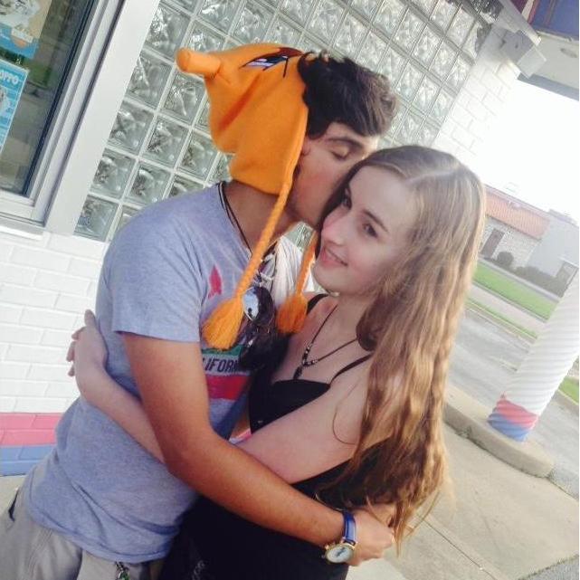 This photo was taken by a friend during one of our first dates. We are standing in front of what used to be Shake's Frozen Custard. - June 1, 2015