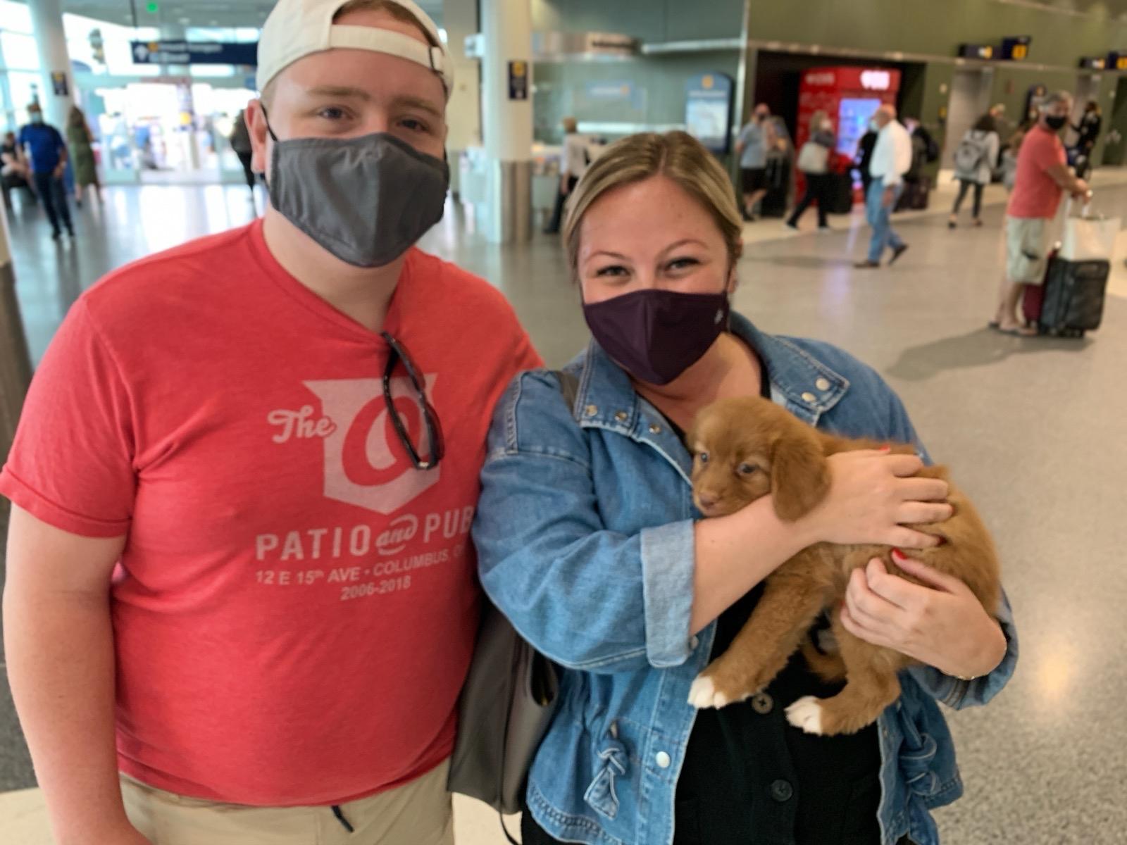 Abby & Dan pick up Maple from Oakland Airport... this picture is minutes before Maple takes her first poop in Abby's lap! How charming!