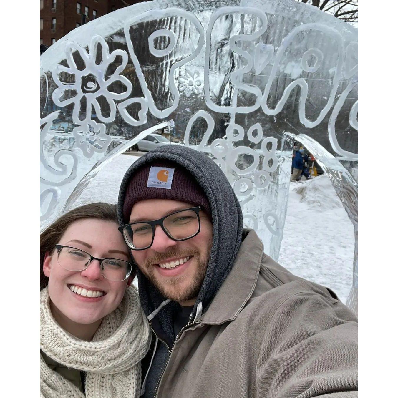 Posing with an ice sculpture during a celebratory anniversary trip to Erie, PA, in 2022.