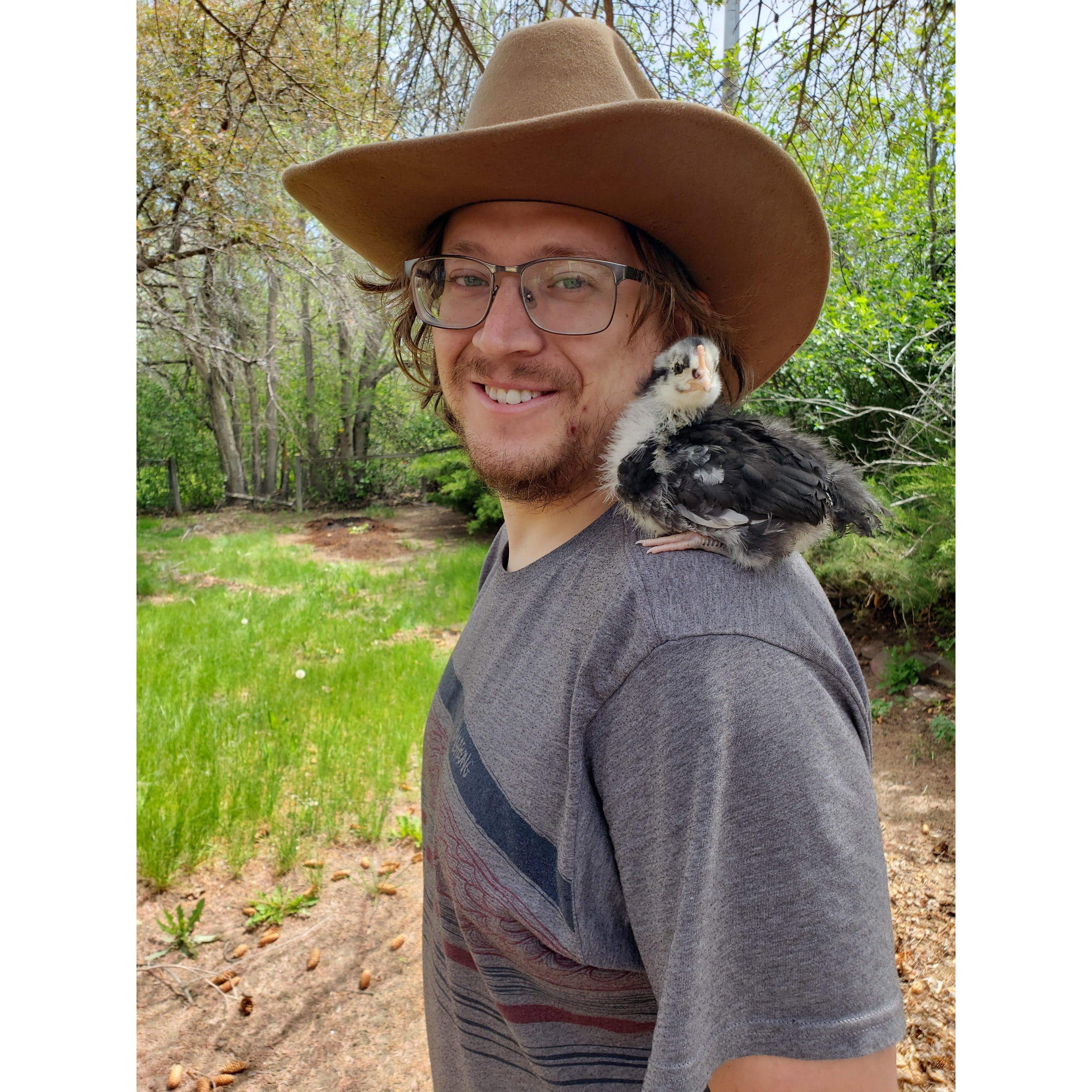 Baby chick on Chris's shoulder.
