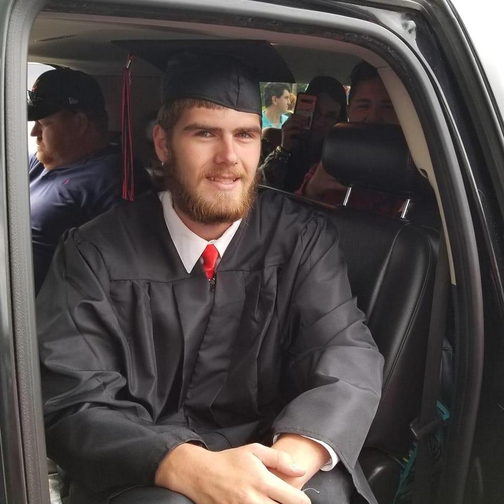 The groom graduating high school.