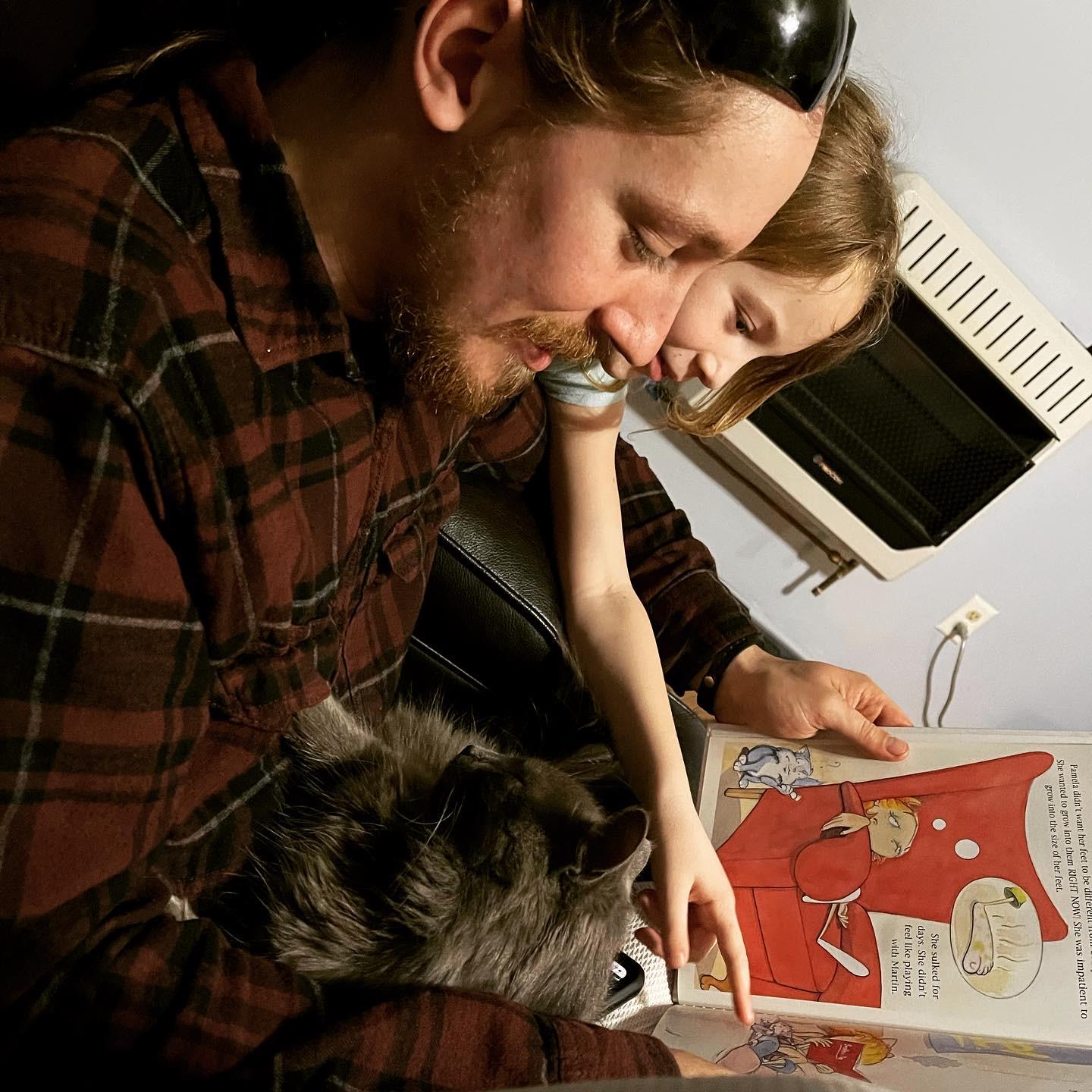 Khia and daddy reading a favorite book.