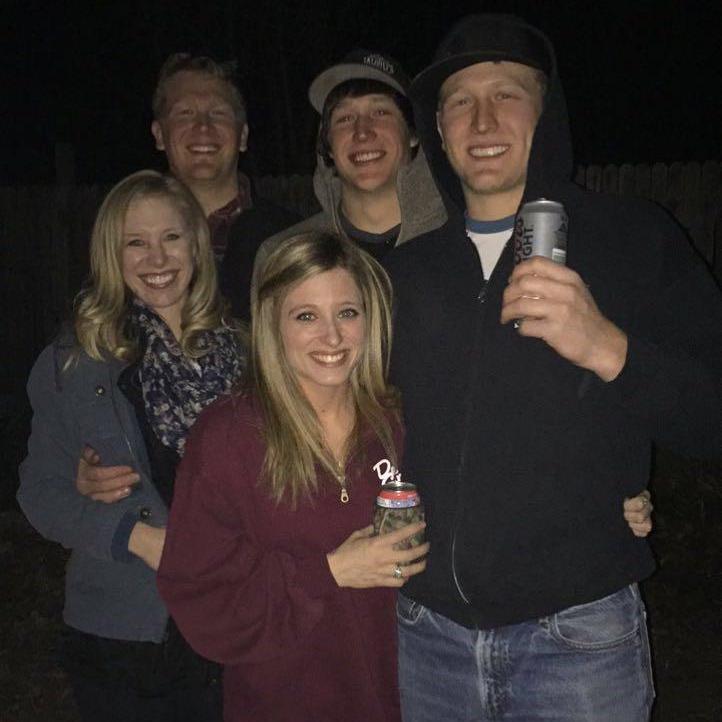 Sitting around the fire with some of Tanner's siblings.