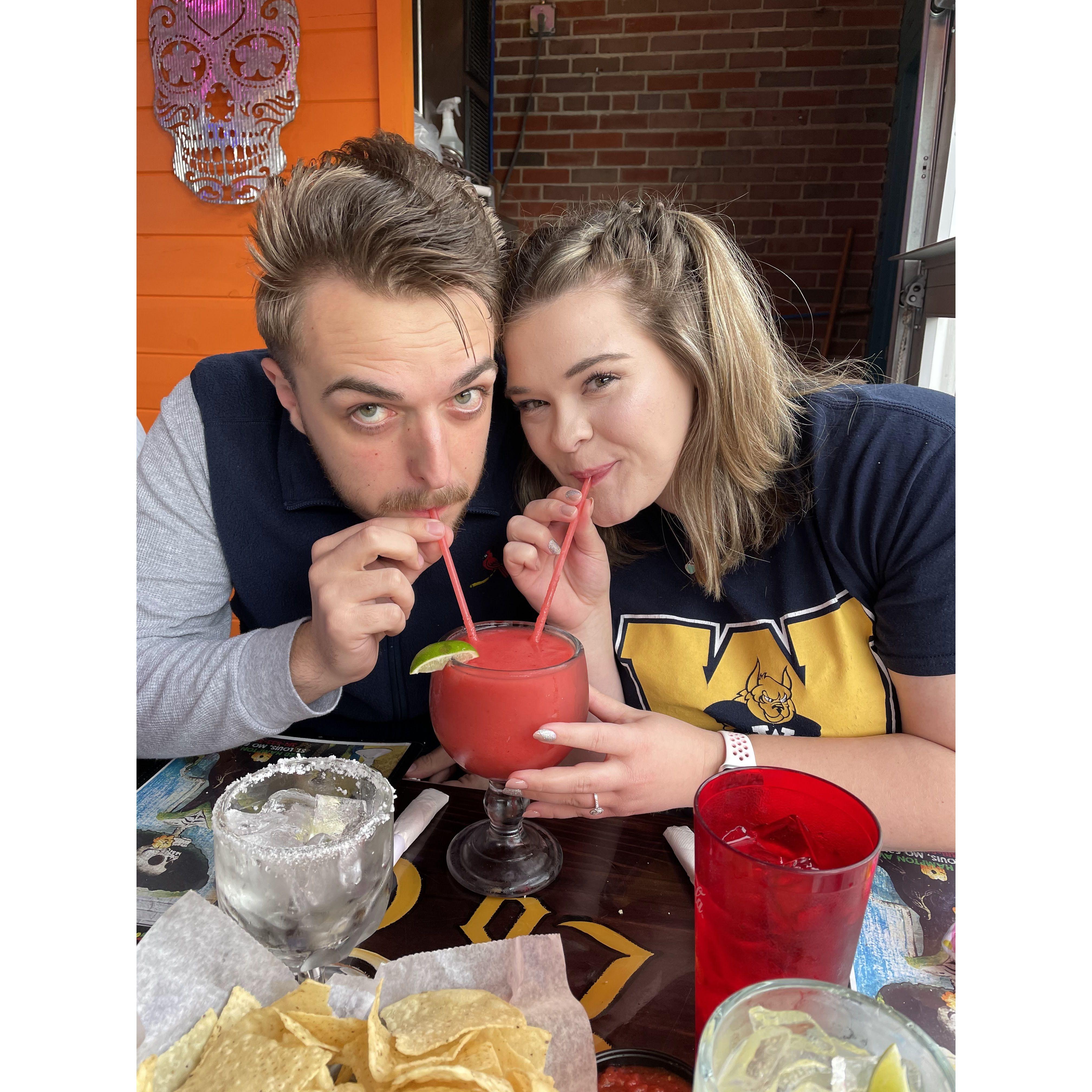 Us celebrating me graduating a year early with a big ol' margarita!