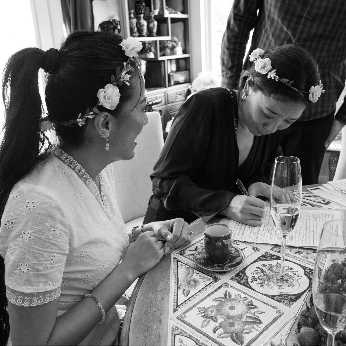Jenny signing as a witness on our marriage license.