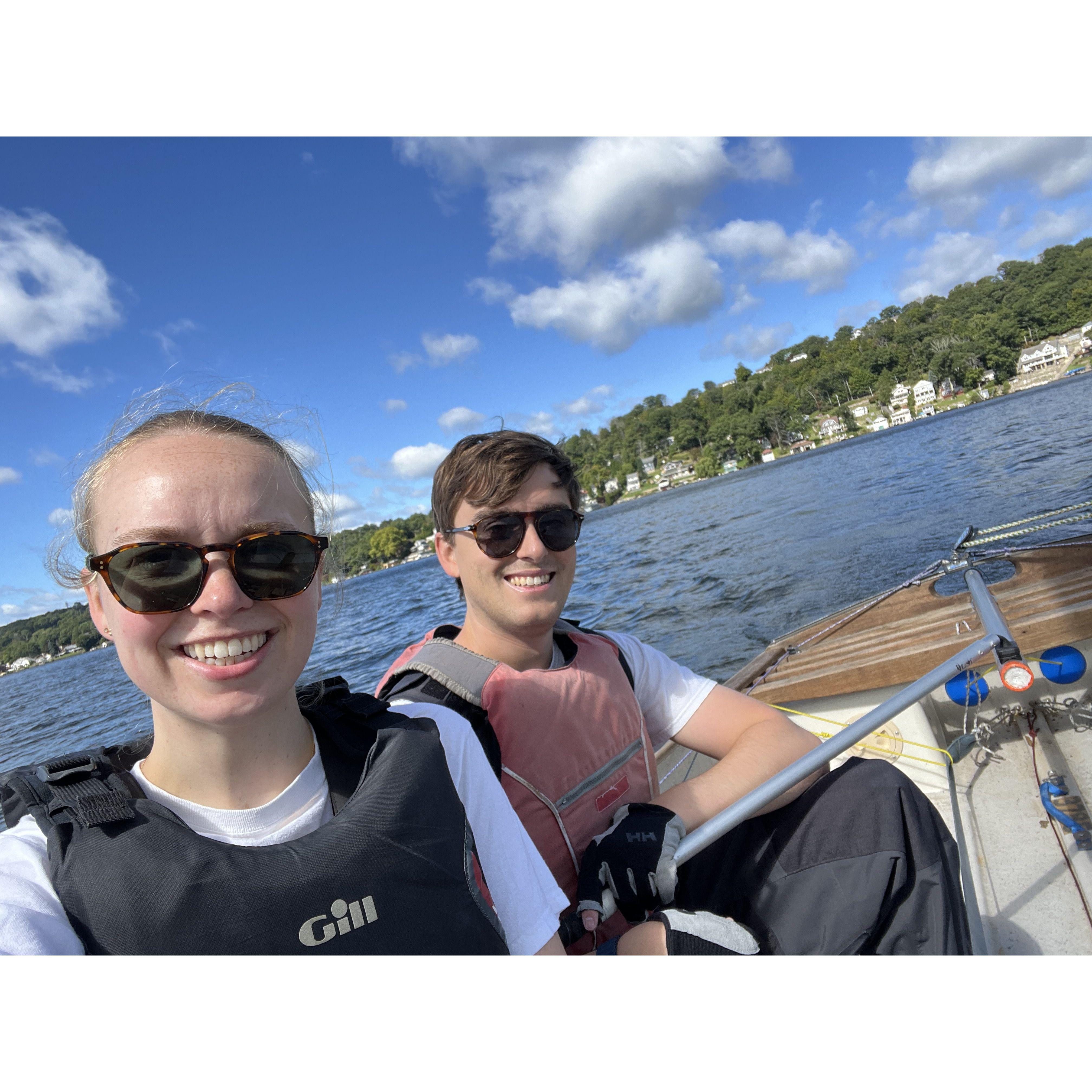 Sailing on our Thistle sailboat this past fall - we met through college sailing and are excited to sail on the same team this time around!