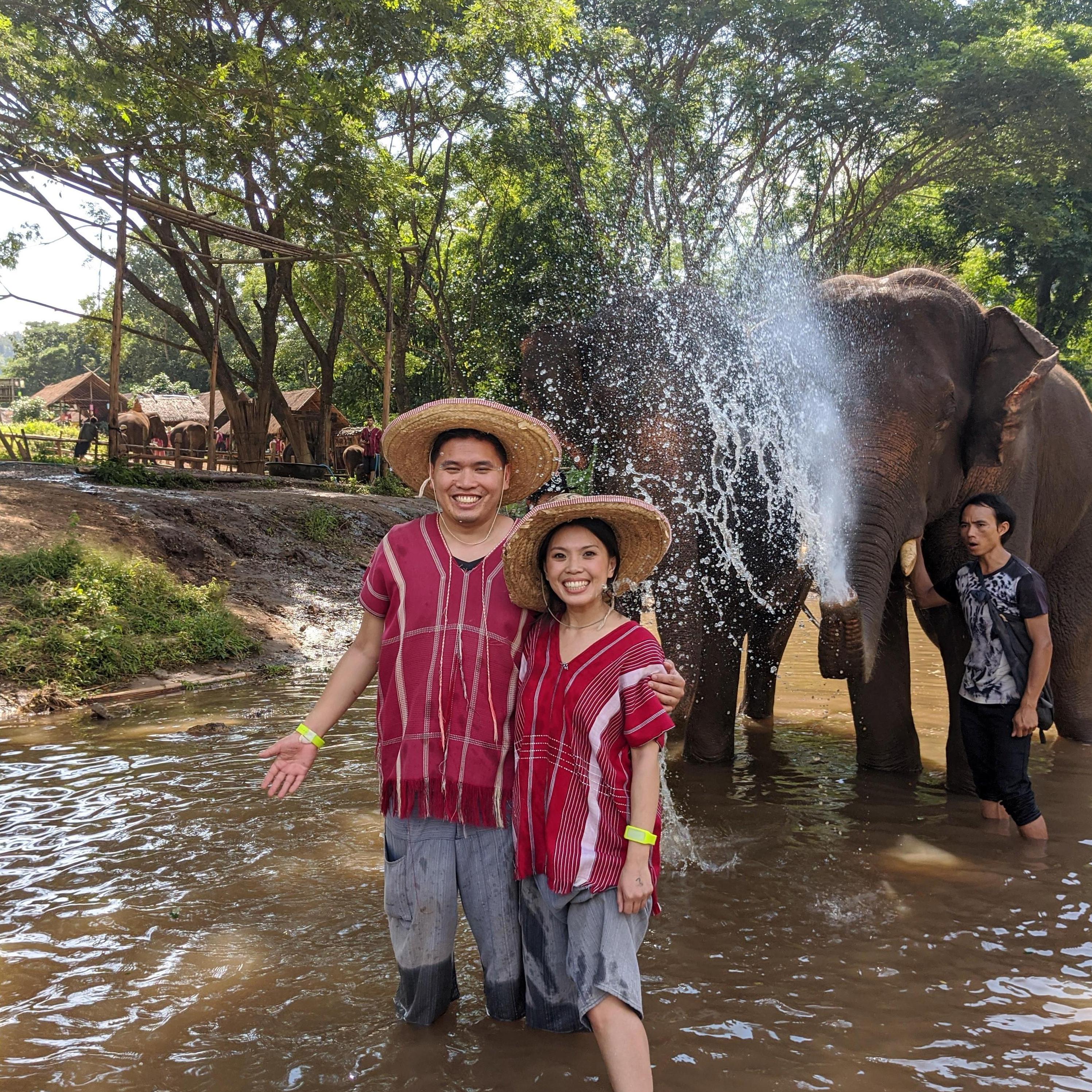 Getting sprayed by the elephants at the Elephant Sanctuary in Thailand for good luck!