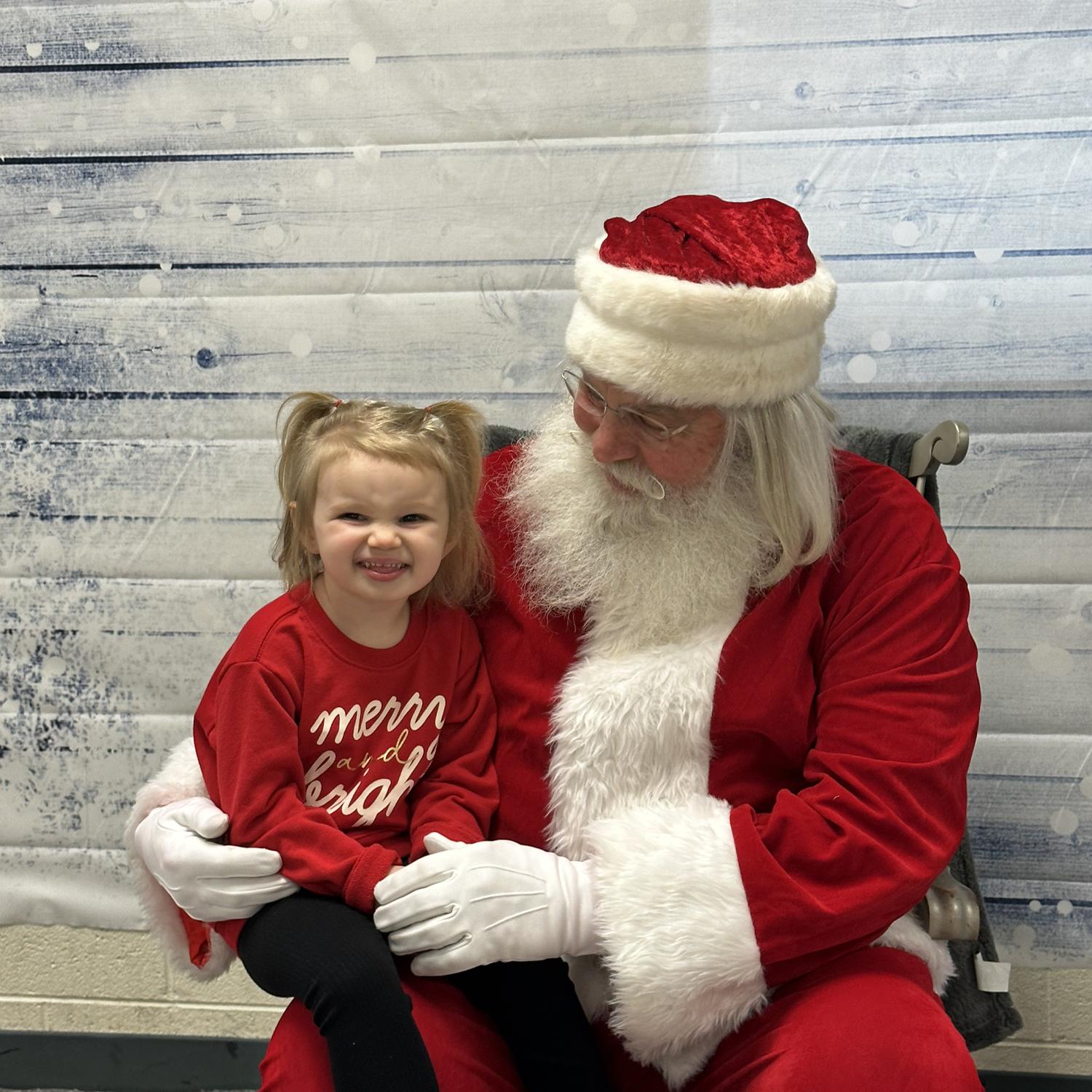 Evie’s first time meeting Santa at St. Mark Baptist Church with some family.