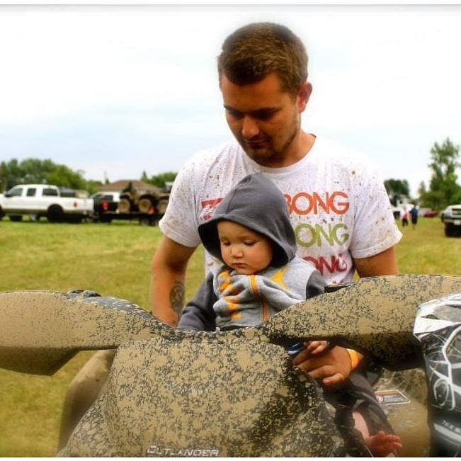 Uncle Doug and Rhys many moons ago at the mud bog in Lakefield.