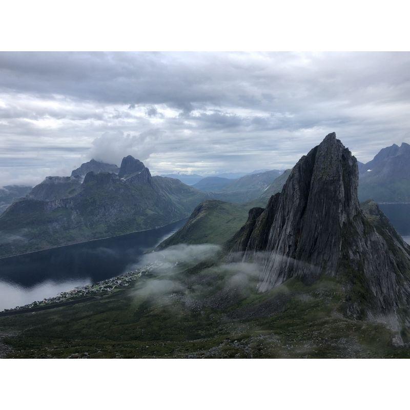 Senja, Norway | Dramatic cliffs peppered with translucent clouds.