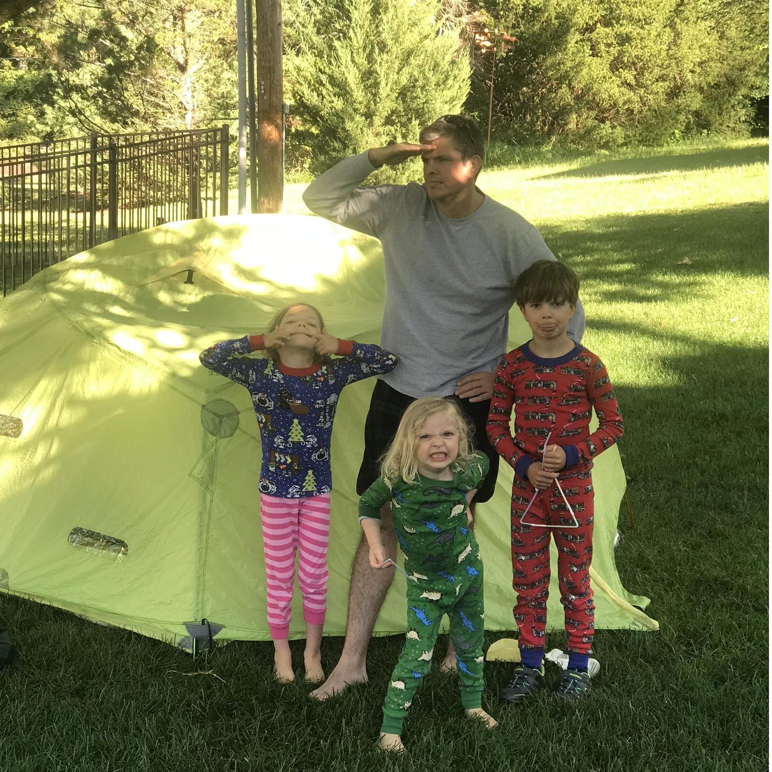 Kevin's love for camping, and the niece and nephews first outdoor camping experience. Only deterred by the 3 AM sprinkler system (suburban camping).
