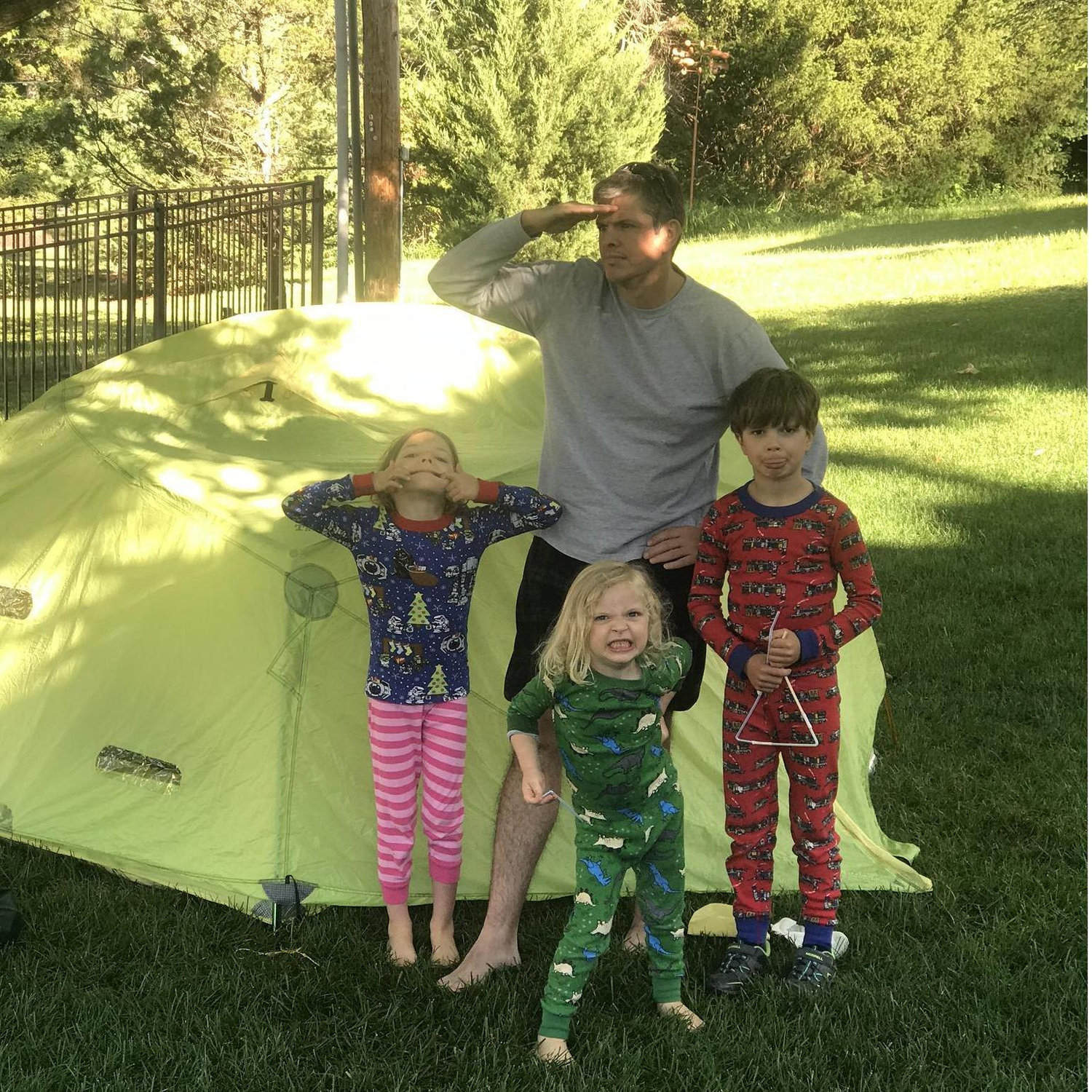 Kevin's love for camping, and the niece and nephews first outdoor camping experience. Only deterred by the 3 AM sprinkler system (suburban camping).