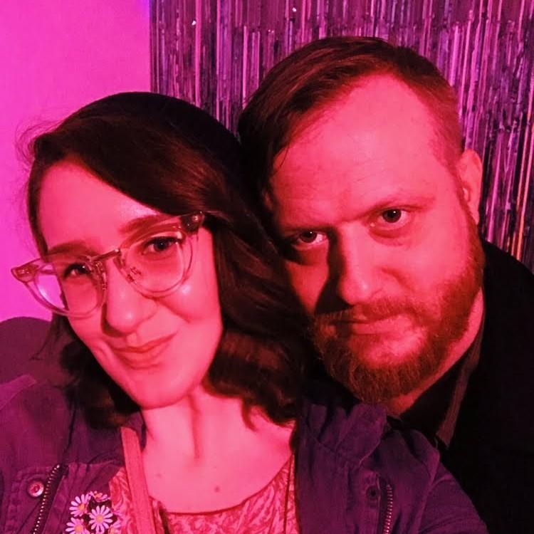 Our first photo as a couple at an art show in March 2019.